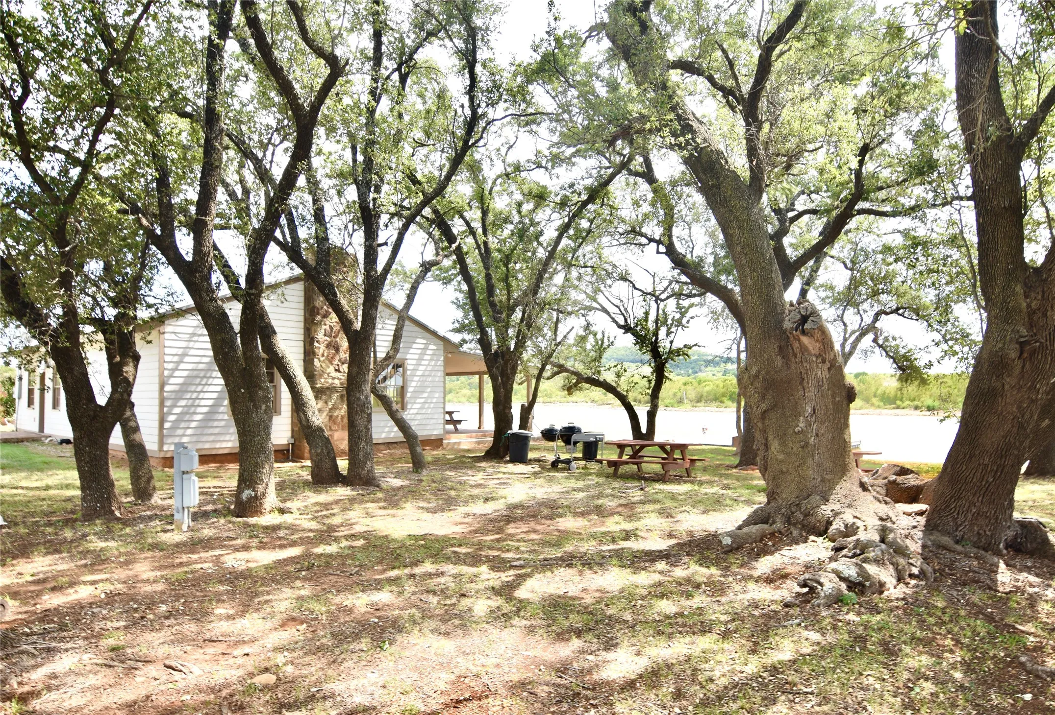 Community Lake Ritchie cabin is nestled under a grove of mature oak trees.