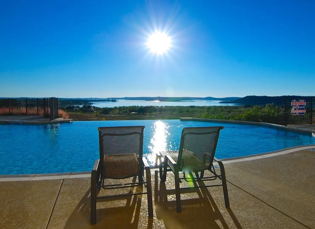 This could be  YOU sitting poolside at the community infinity swimming pool overlooking the NE side of PK lake.