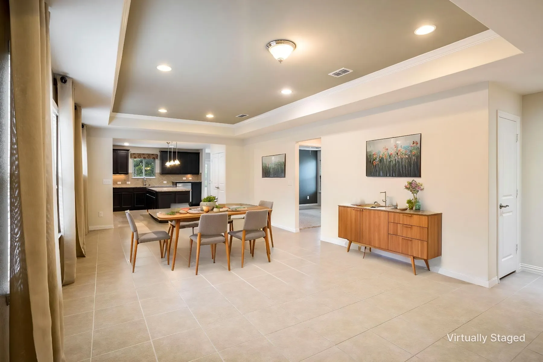 Virtually Staged Dining area that is open concept with Living-Dining-Kitchen.  (Living furniture not shown in this photo)