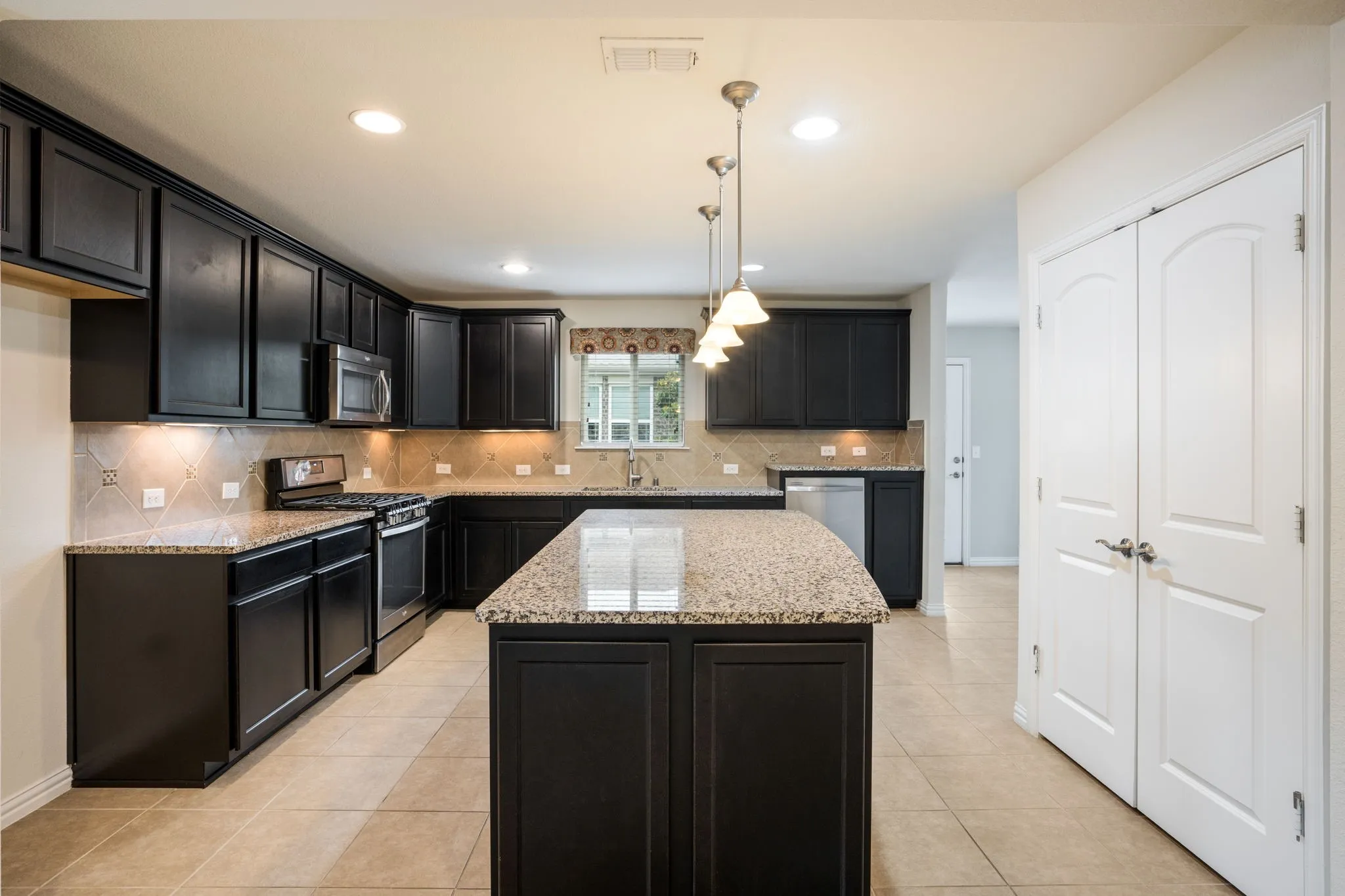 Large pantry and gas range  plus microwave.