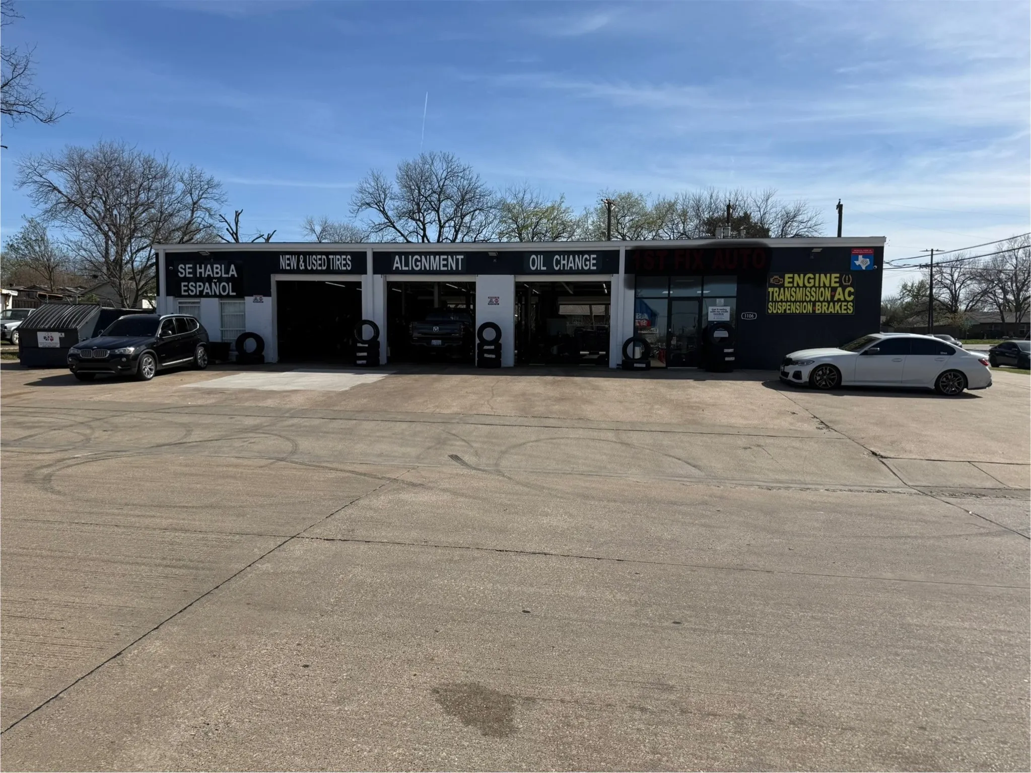 Commercial building featuring a concrete lot and a flat roof