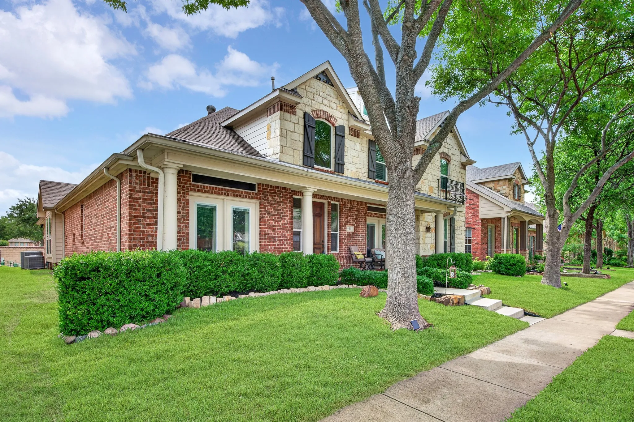 Immaculate mature treed lawn with established shrubbery
