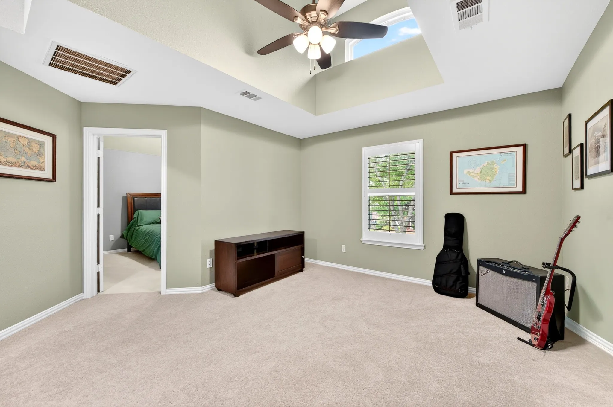 Second floor loft with vaulted ceiling and sky window for extra natural light