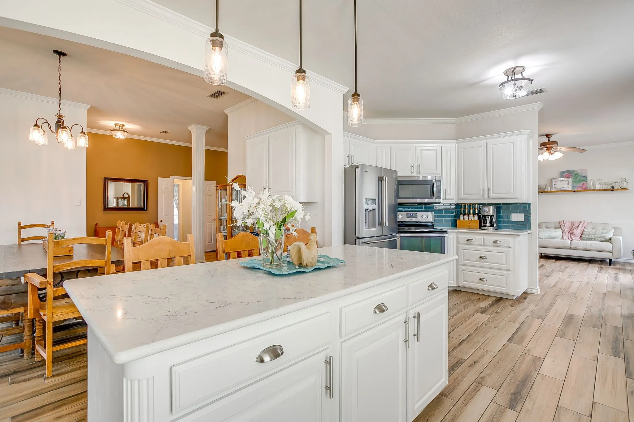 Pendant lighting above island.