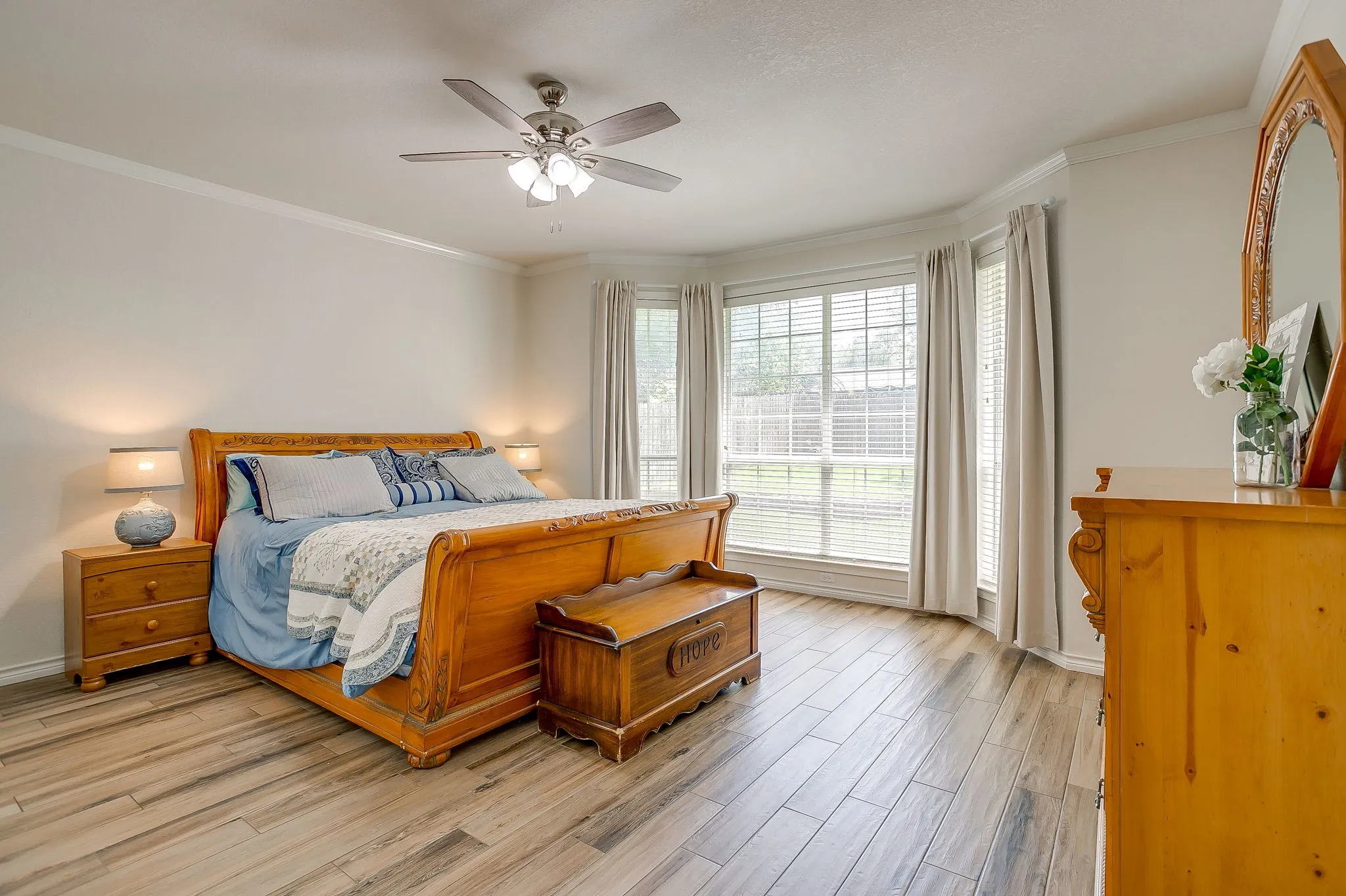 Primary bedroom with bay windows.