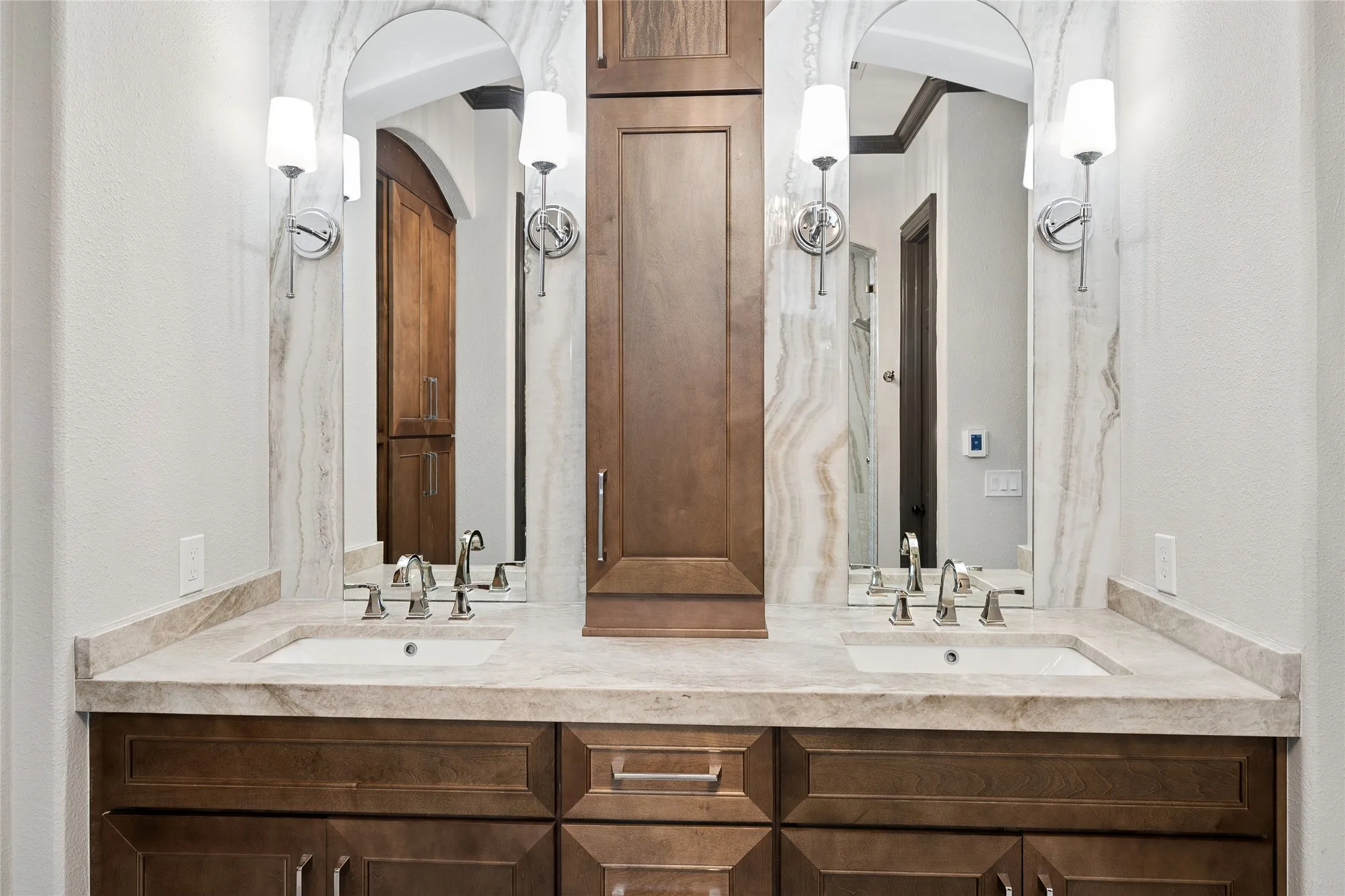 Dual sinks and ample built-ins. Note quartize counters in all the bathrooms.