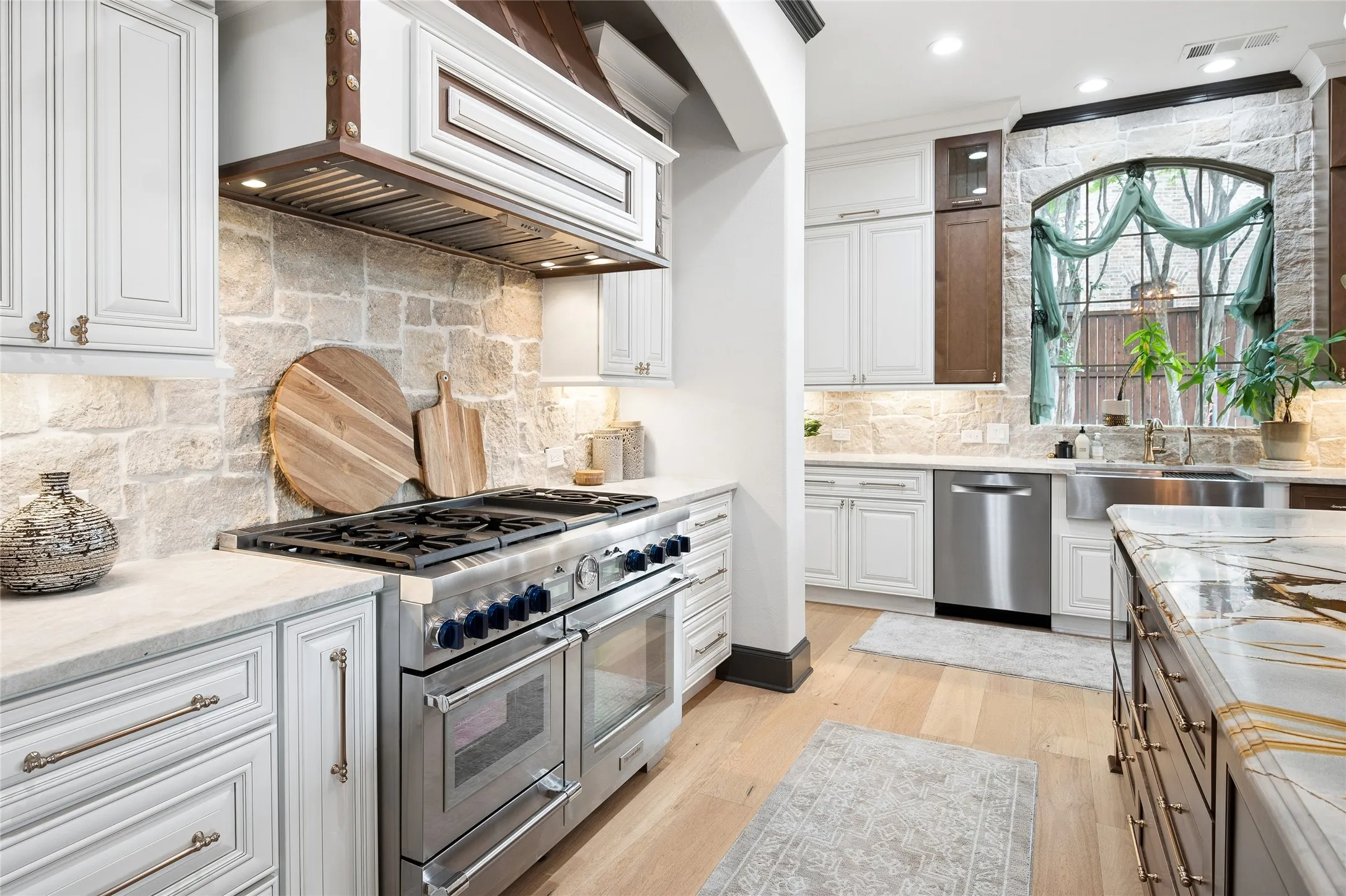 Thermador Pro Grand stove features gas and steam ovens. Thermador MV30WS microwave. Bosch 800 dishwasher. Built-in refrigerator and 2 wine refrigerator coolers,