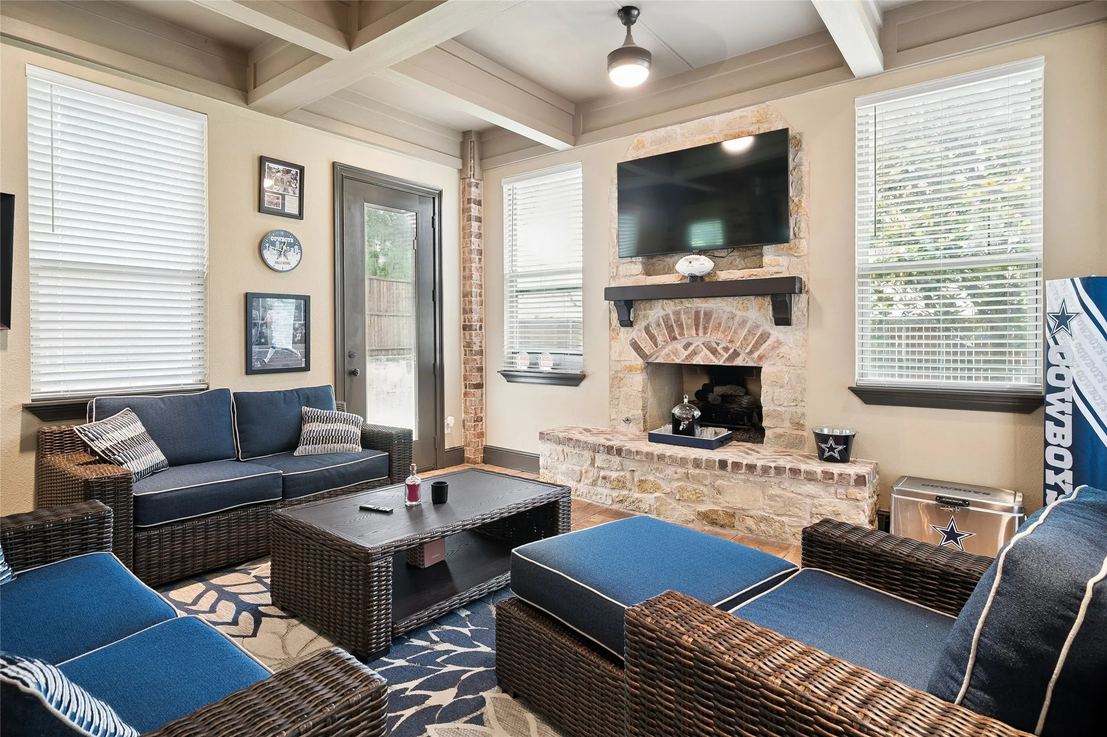 Enclosed patio with beam ceiling, wine refrig, gas starter fireplace with a stone hearth. 2 doors lead to the outside