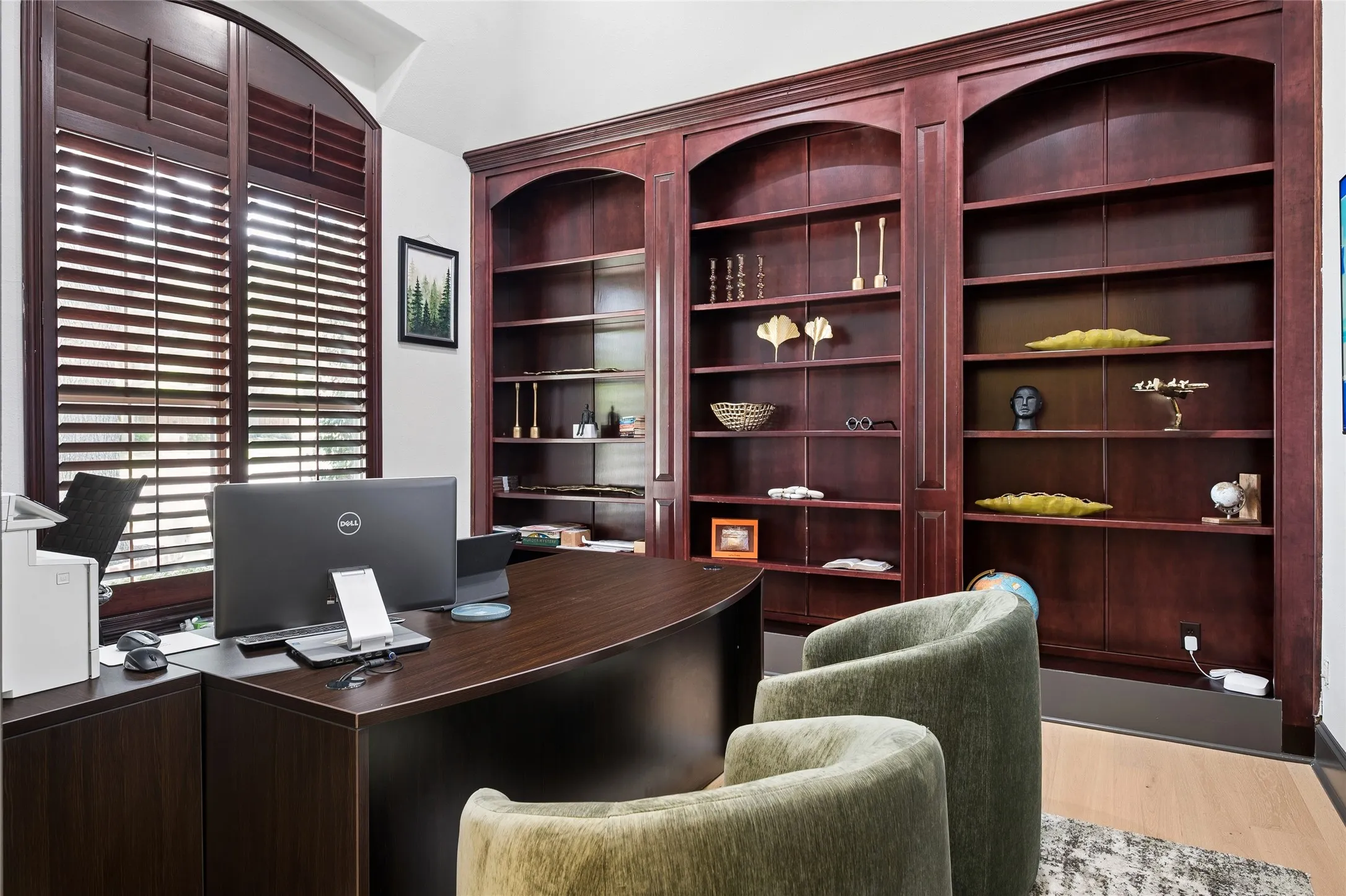 Home office or library with Plantation shutters, built-ins and French doors for privacy