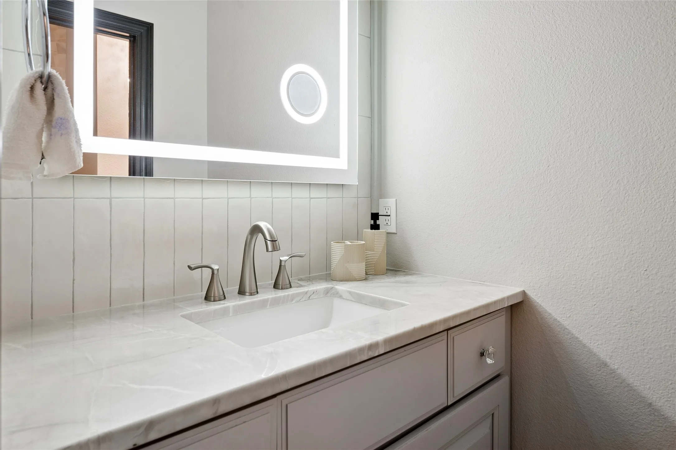 Both sides of bath offer smart mirrors and quartize vanity tops.