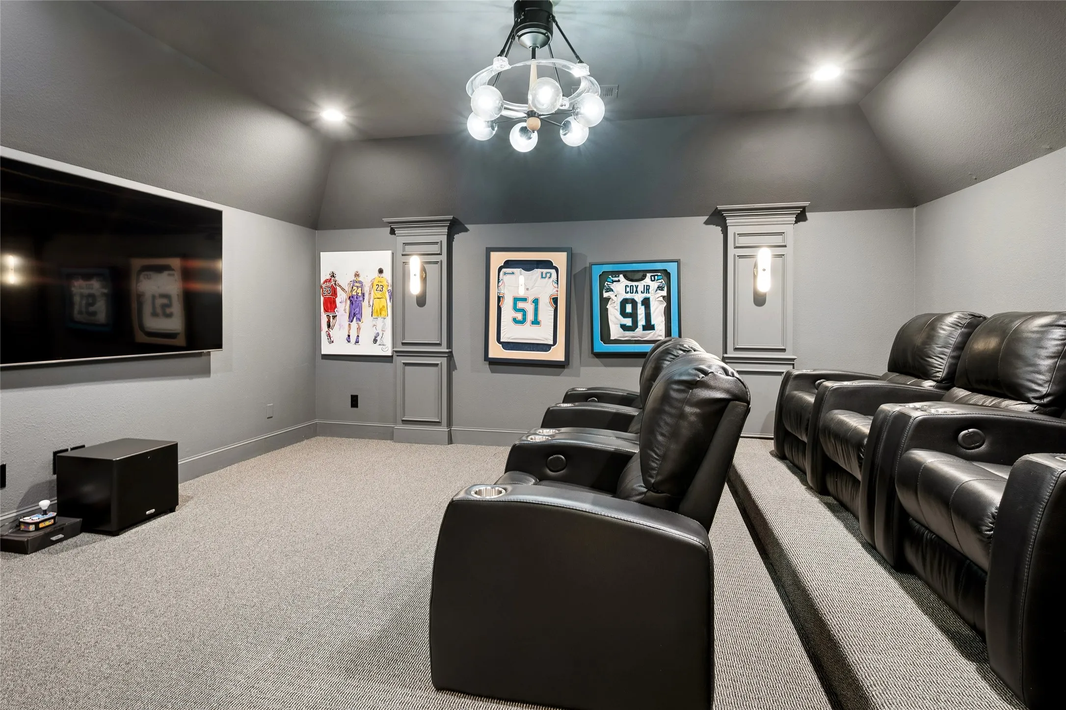 Meadia Room features carpet for sound, unique fan light, recessed lighting and 4 pretty sconces. Theater seating and TV convey.