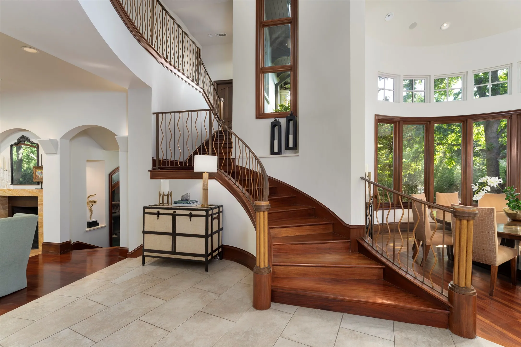 Graceful staircase cascading down to the entry and formal areas.
