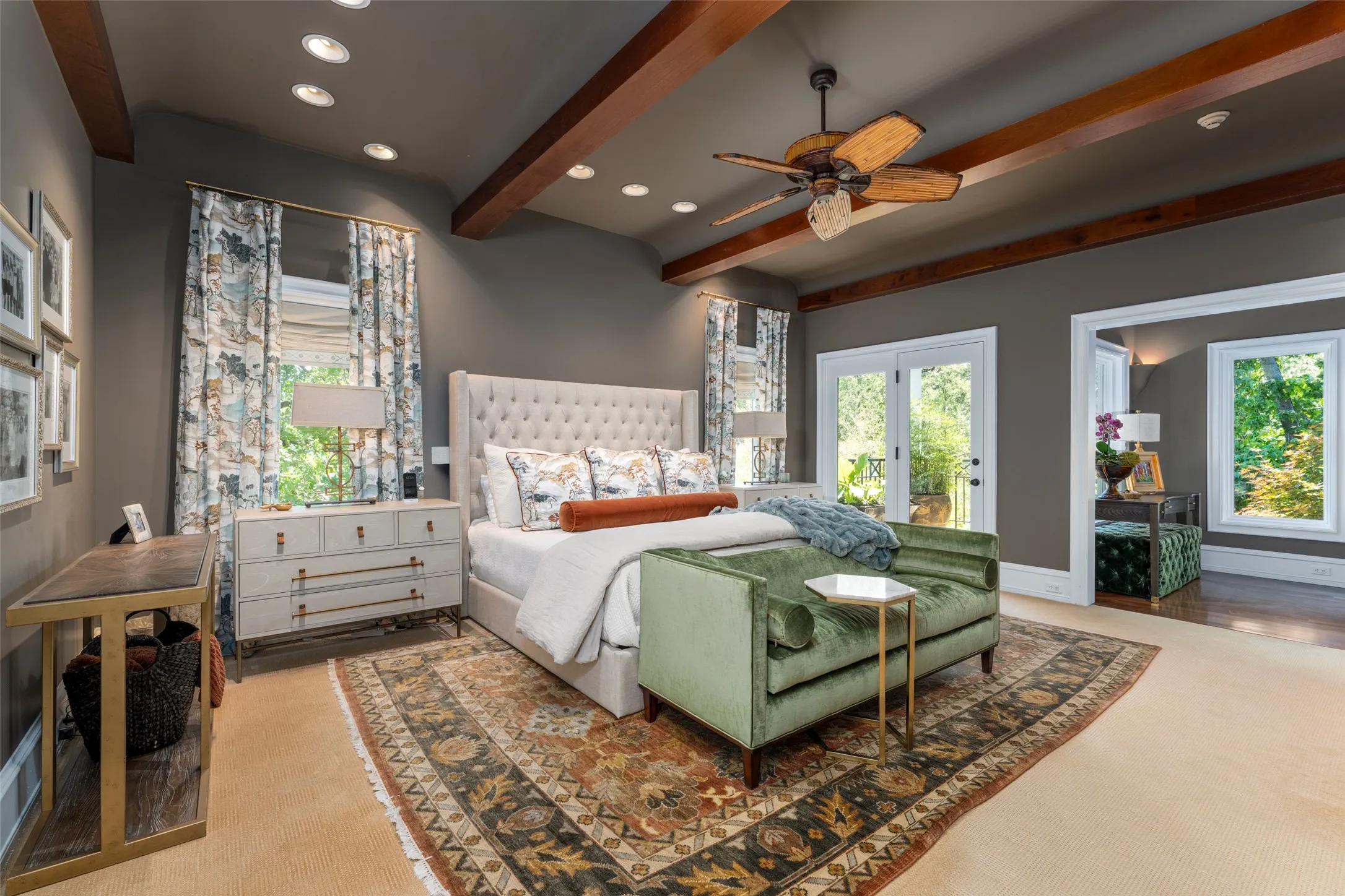 The primary bedroom has a beamed ceiling and
great views to the front gardens.