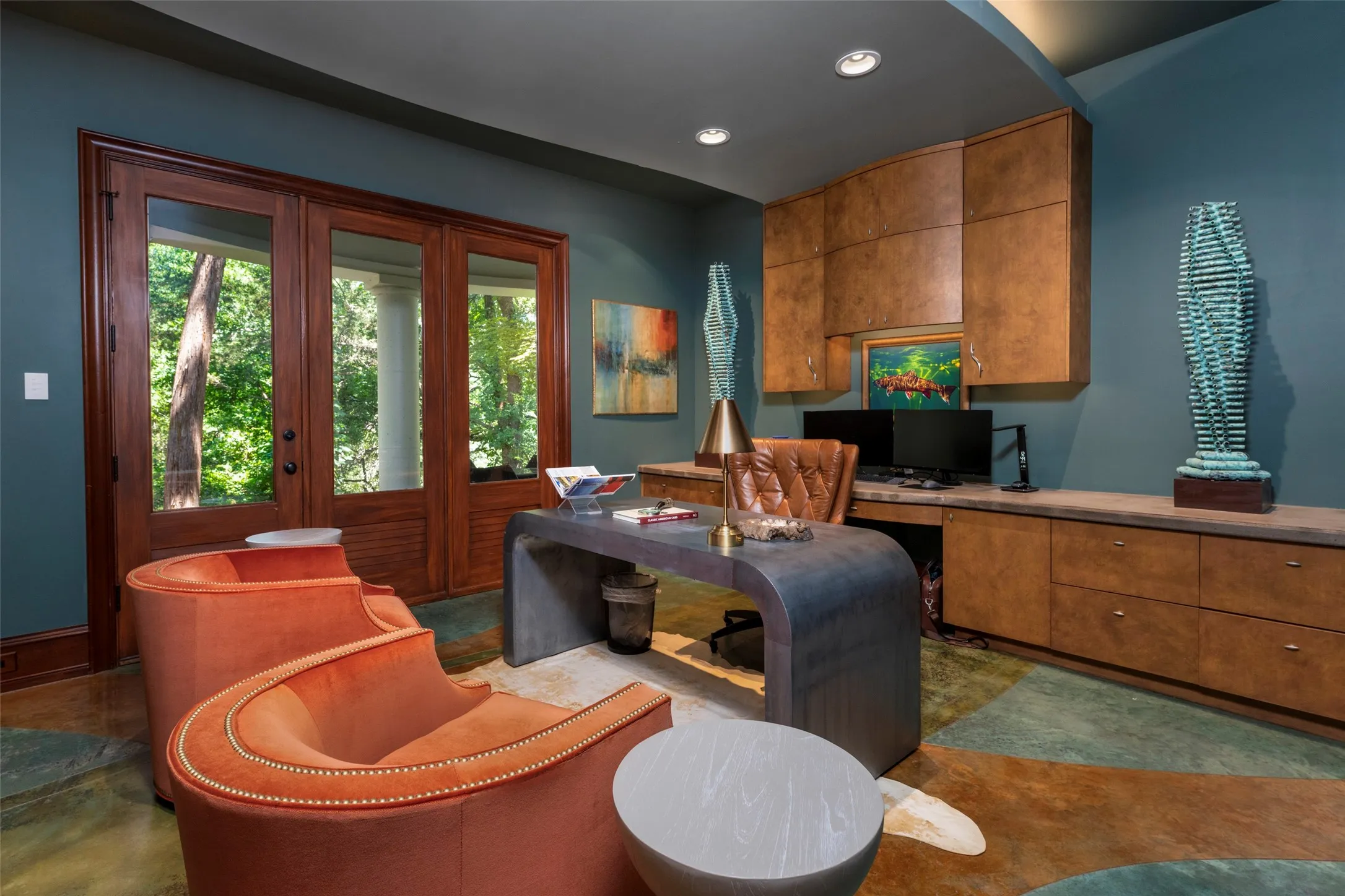 The study enjoys patio access from beautiful doors.
Included is a built in desk, custom built-in cabinets
and shelving.
