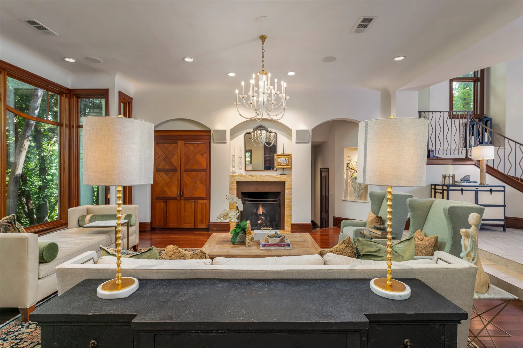 A cozy fireplace greets you in this lovely formal living.