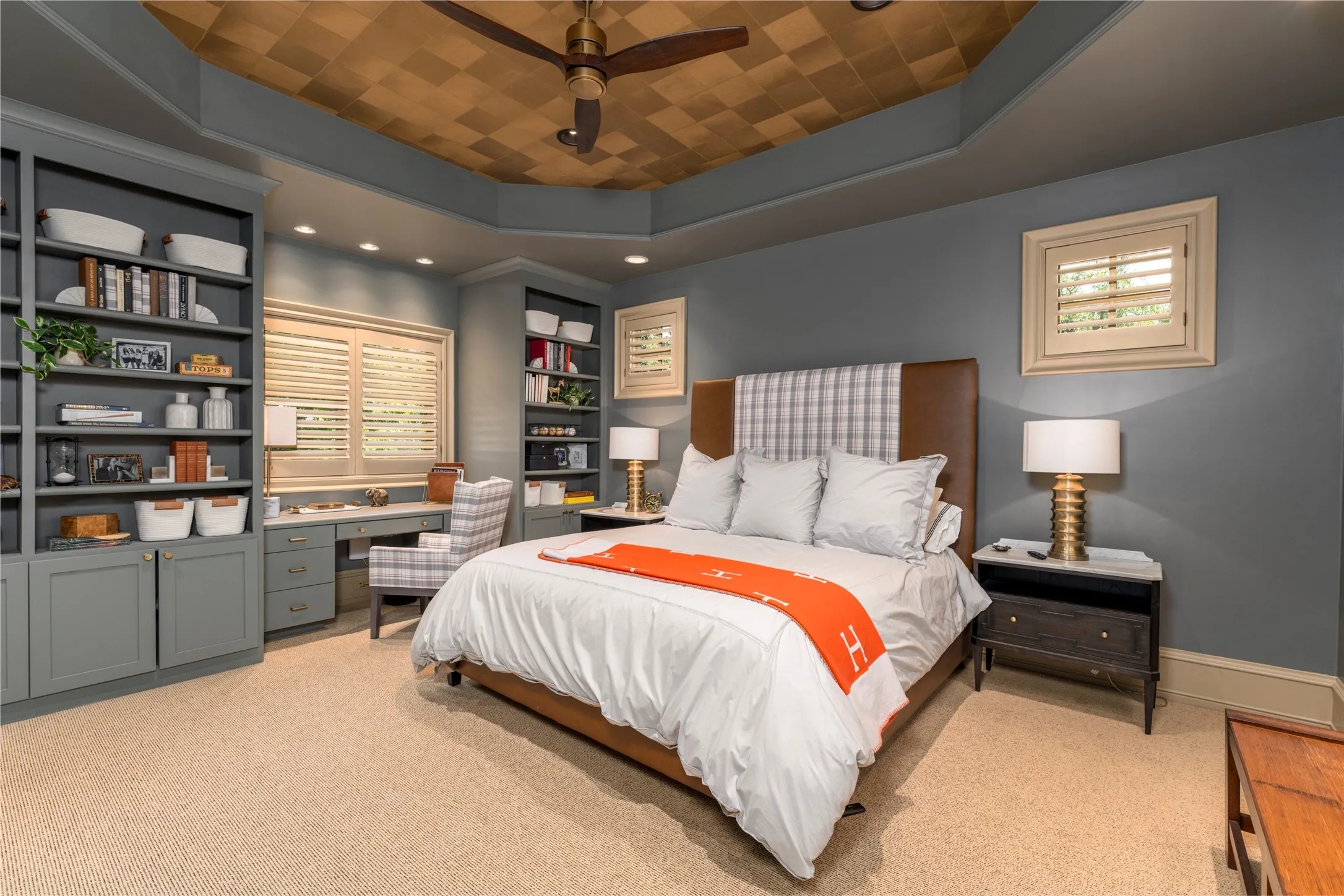 This secondary bedroom upstairs has great custom
built-ins and decorative tray ceiling.