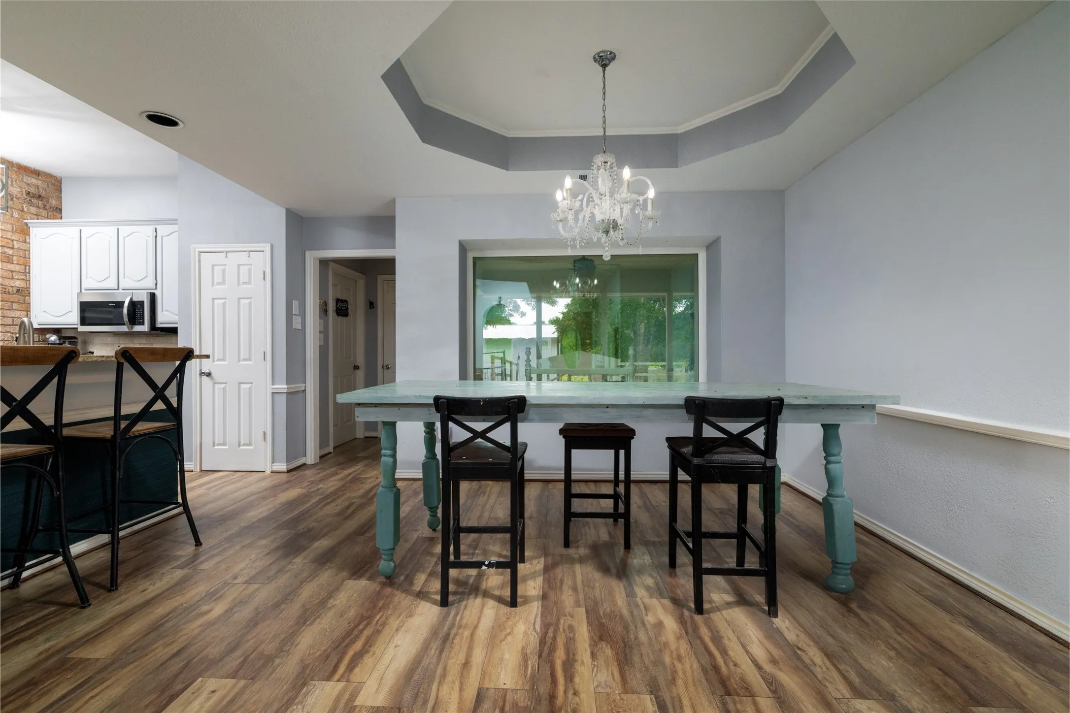 Open concept dining area with Laminate wood look flooring