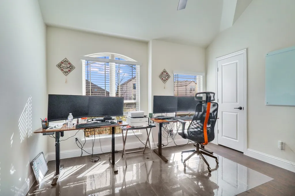 Office area featuring healthy amount of natural light and vaulted ceiling