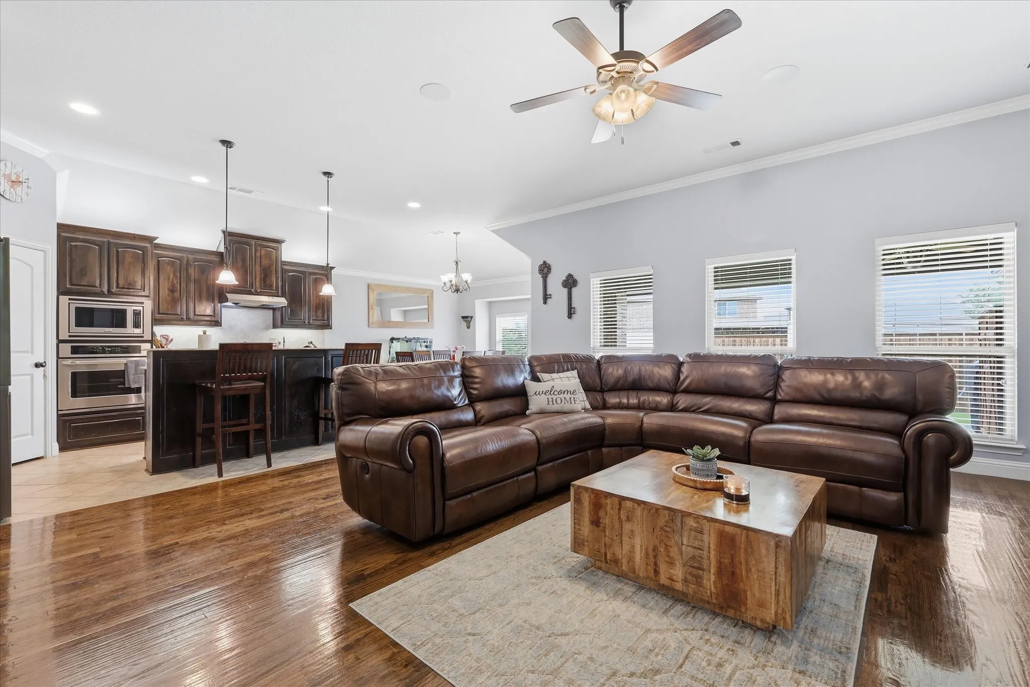 Open-concept living space featuring wood-finish flooring