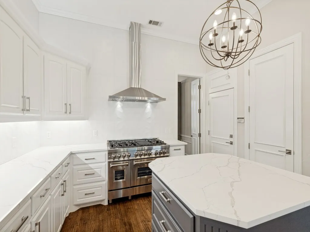A true chef's kitchen - direct access to garage. The island is complete with lots of storage.