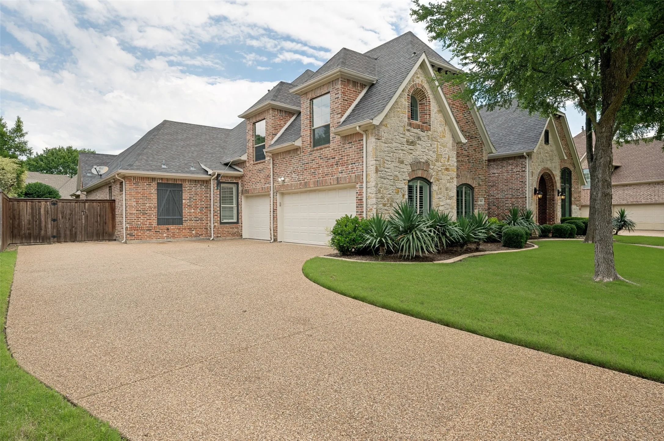 Side driveway to oversized 3-car garage.