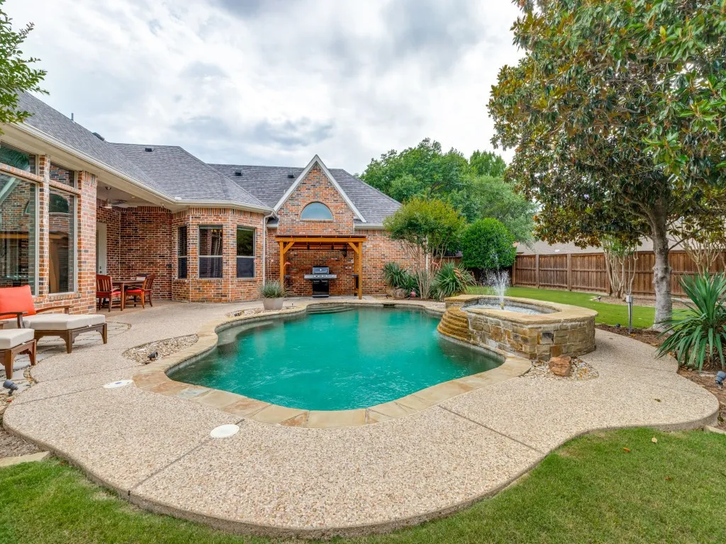 Covered patio and grill area and lots of open deck.