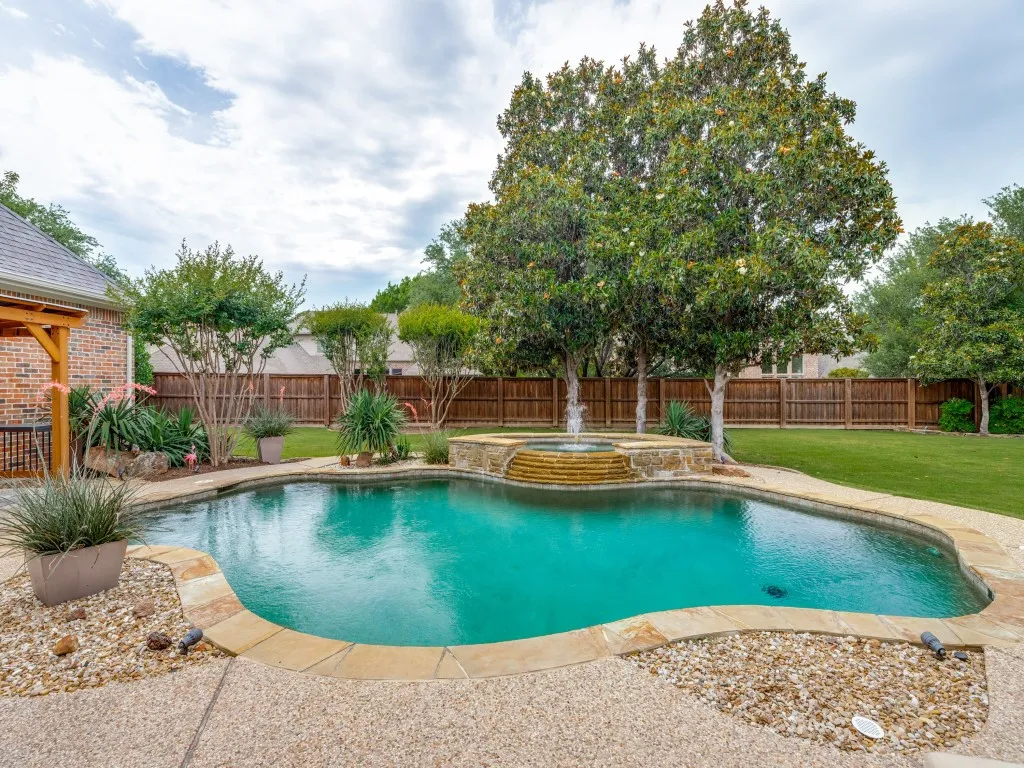 Spacious pool with raised spa for leisure time activities.