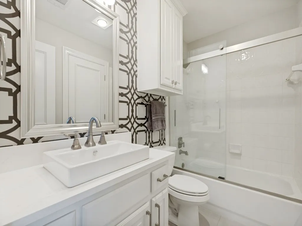 Upstairs bath serves the bedrooms and game-media rooms.