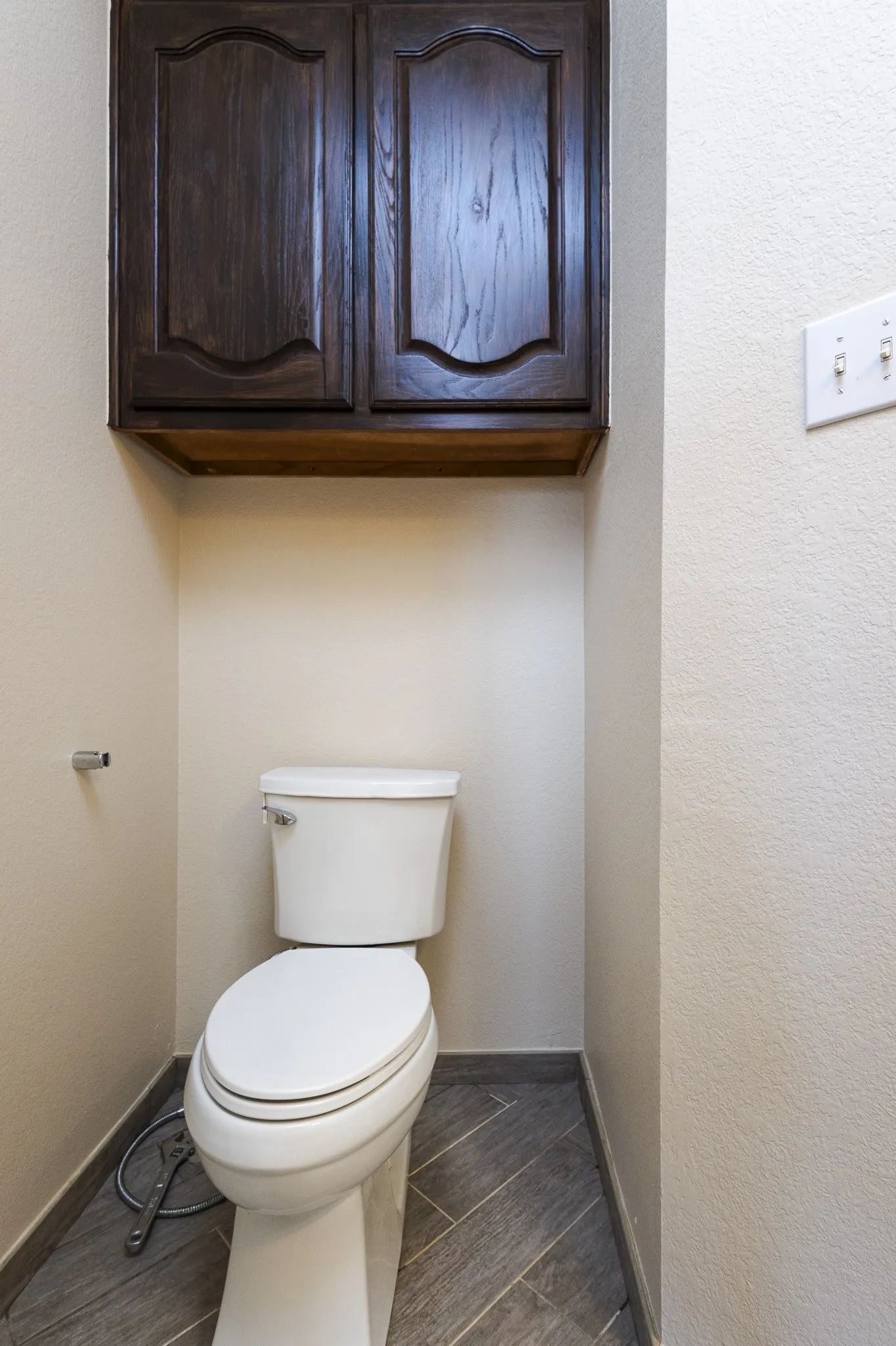 Bathroom with tile flooring and toilet
