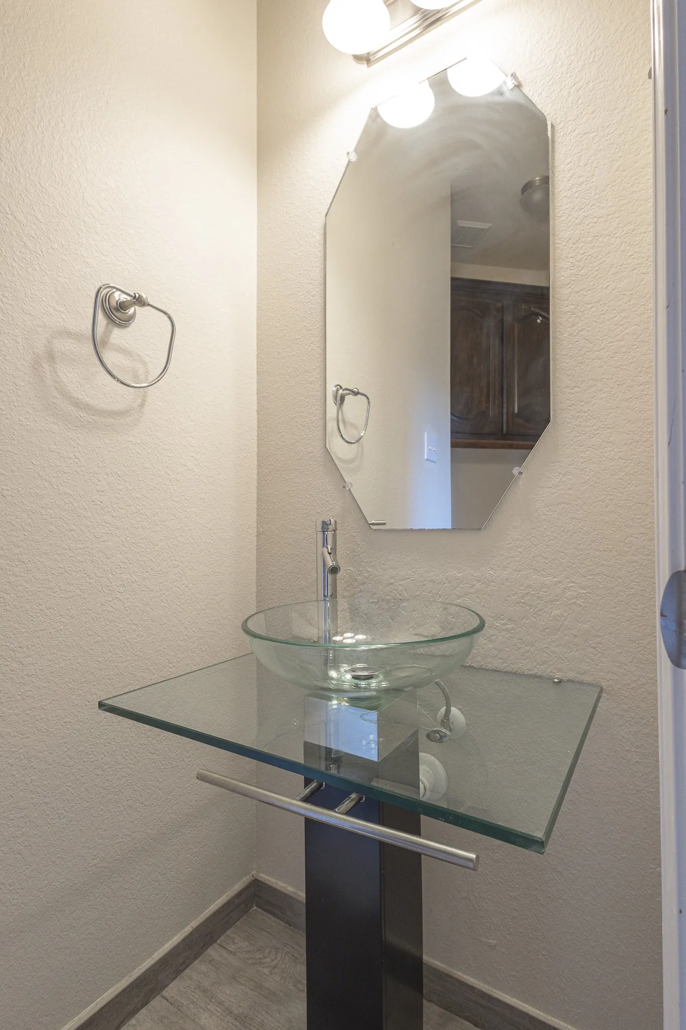 Bathroom with sink and hardwood / wood-style floors