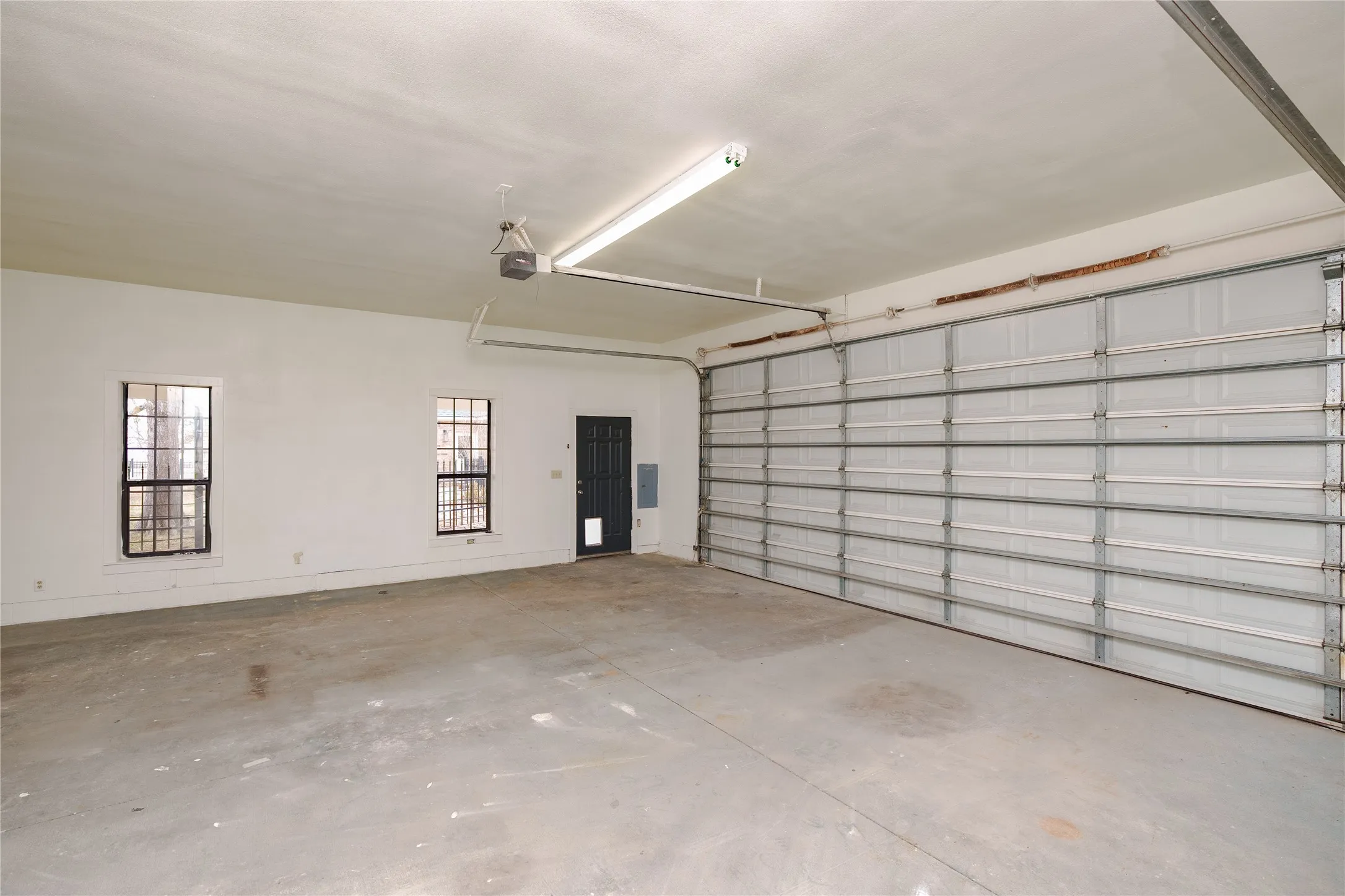 Spacious secondary garage with attached living or office space with kitchen and bathroom.