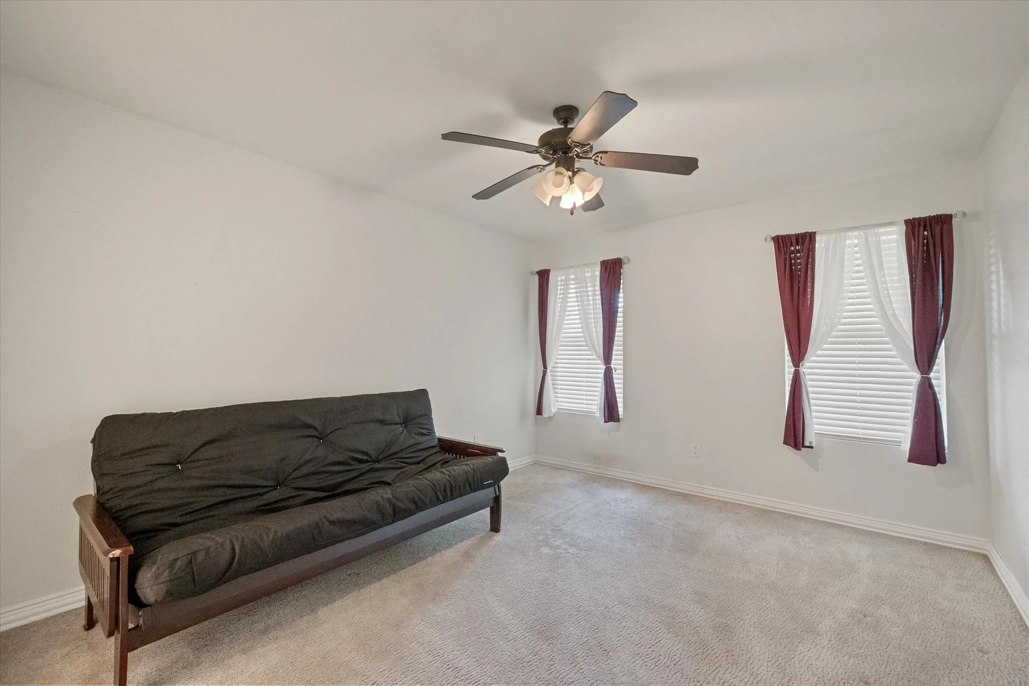 Neutral tone walls and carpeting create a versatile interior space