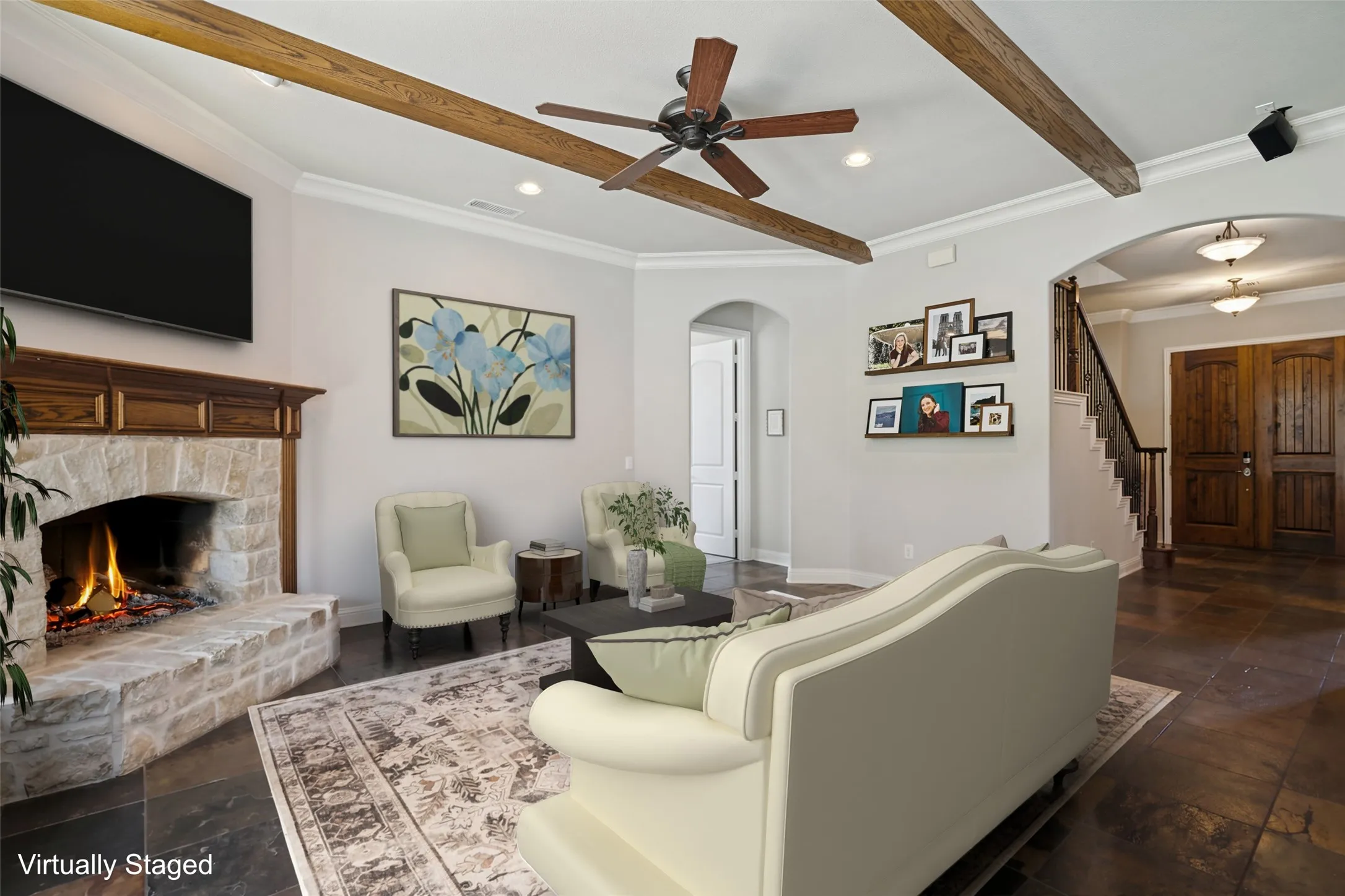 Virtually staged. Spacious living room with fireplace.