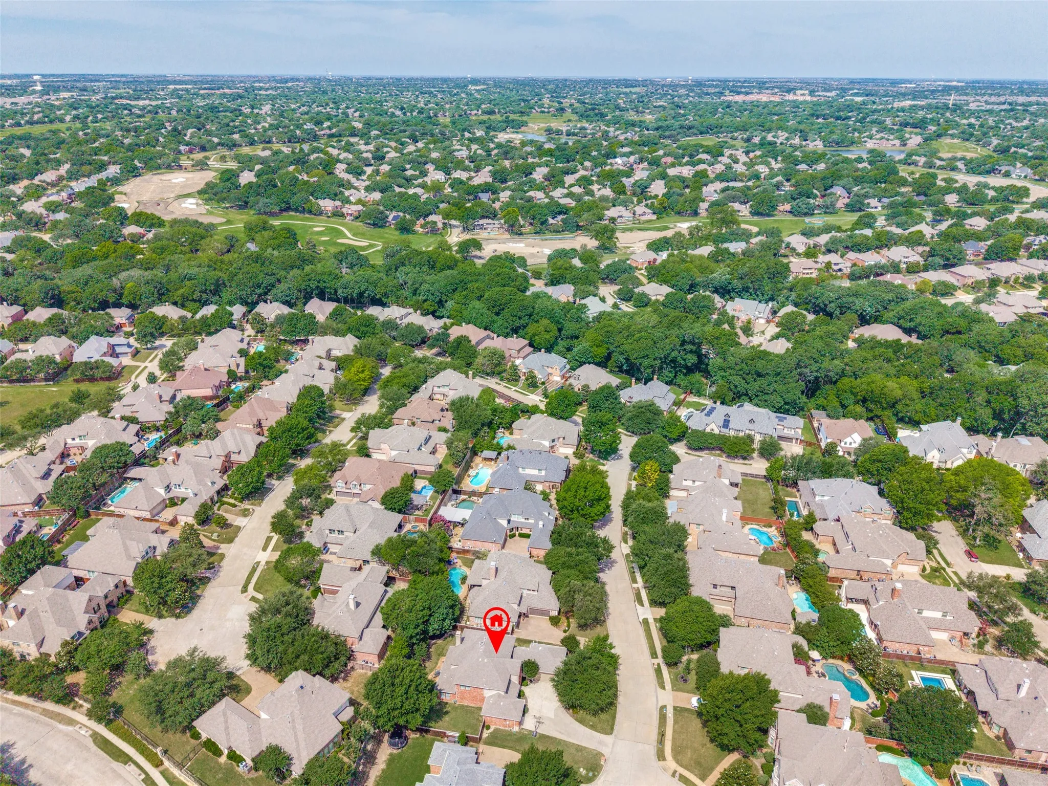 Expansive residential neighborhood featuring numerous properties with traditional architecture and mature trees