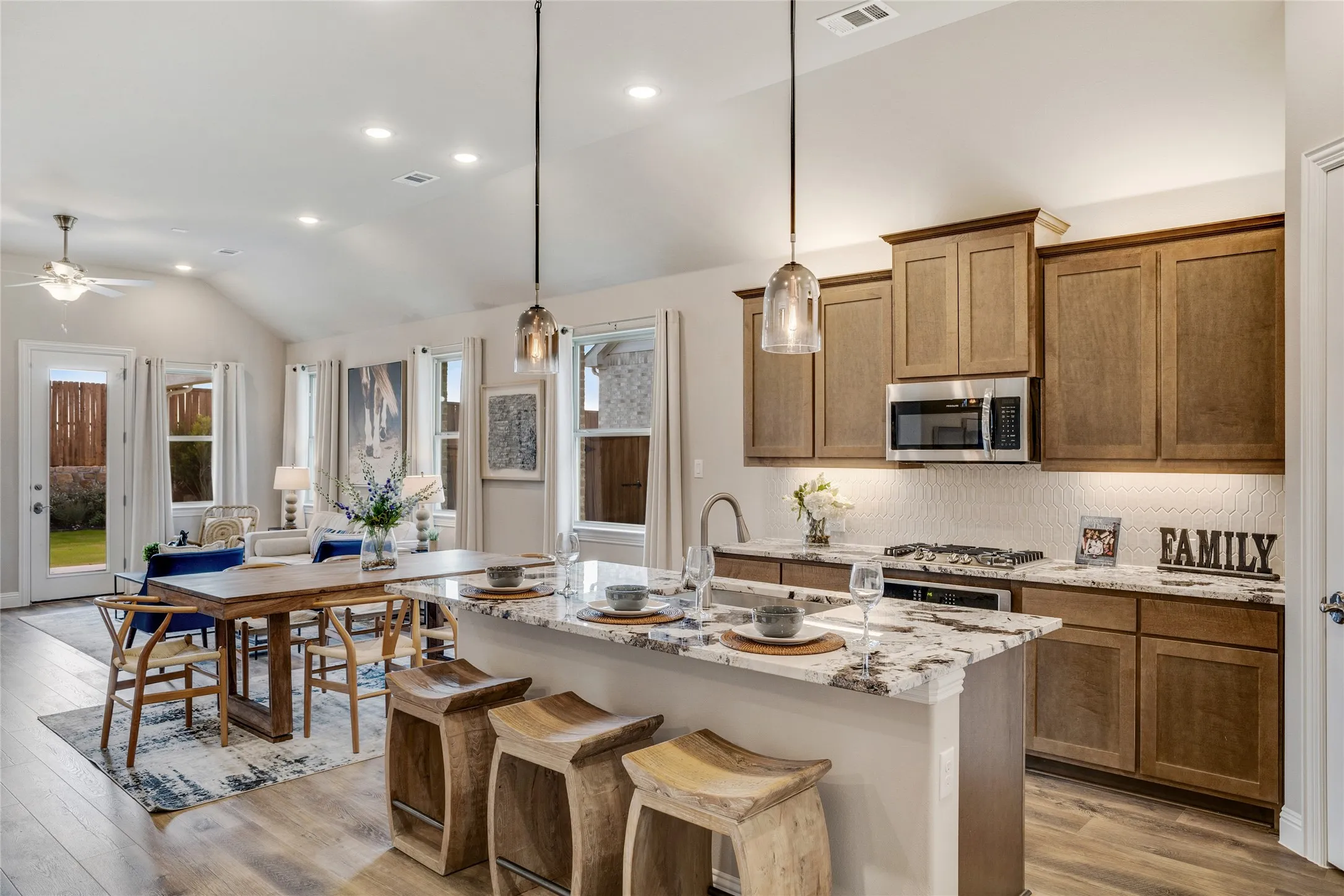 Open-concept living area with a vaulted ceiling