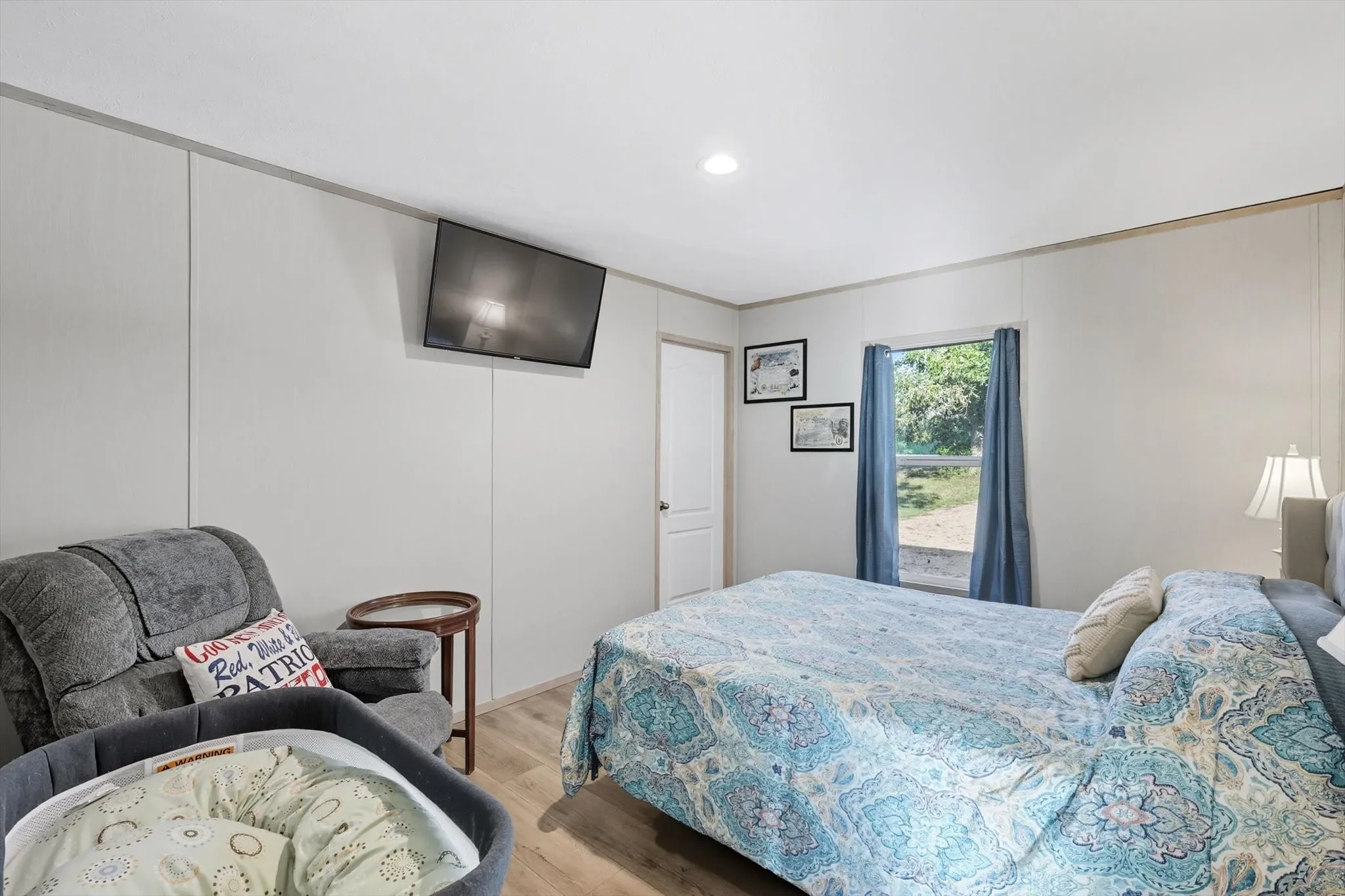 Bedroom featuring wood finished floors and recessed lighting