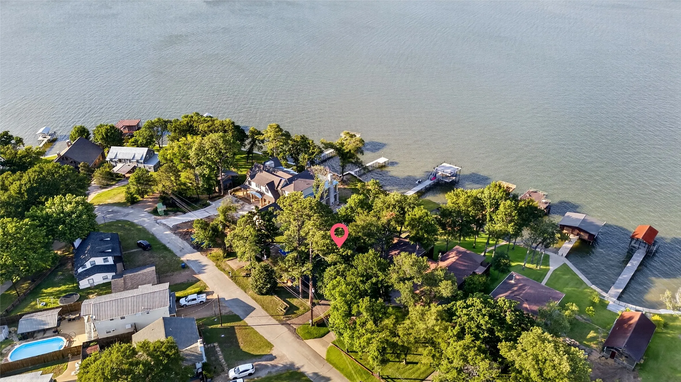 Waterfront property featuring mature trees and a the main body of water. This residence is located in the middle of Cedar Creek Lake. Isn't that water view stunning?