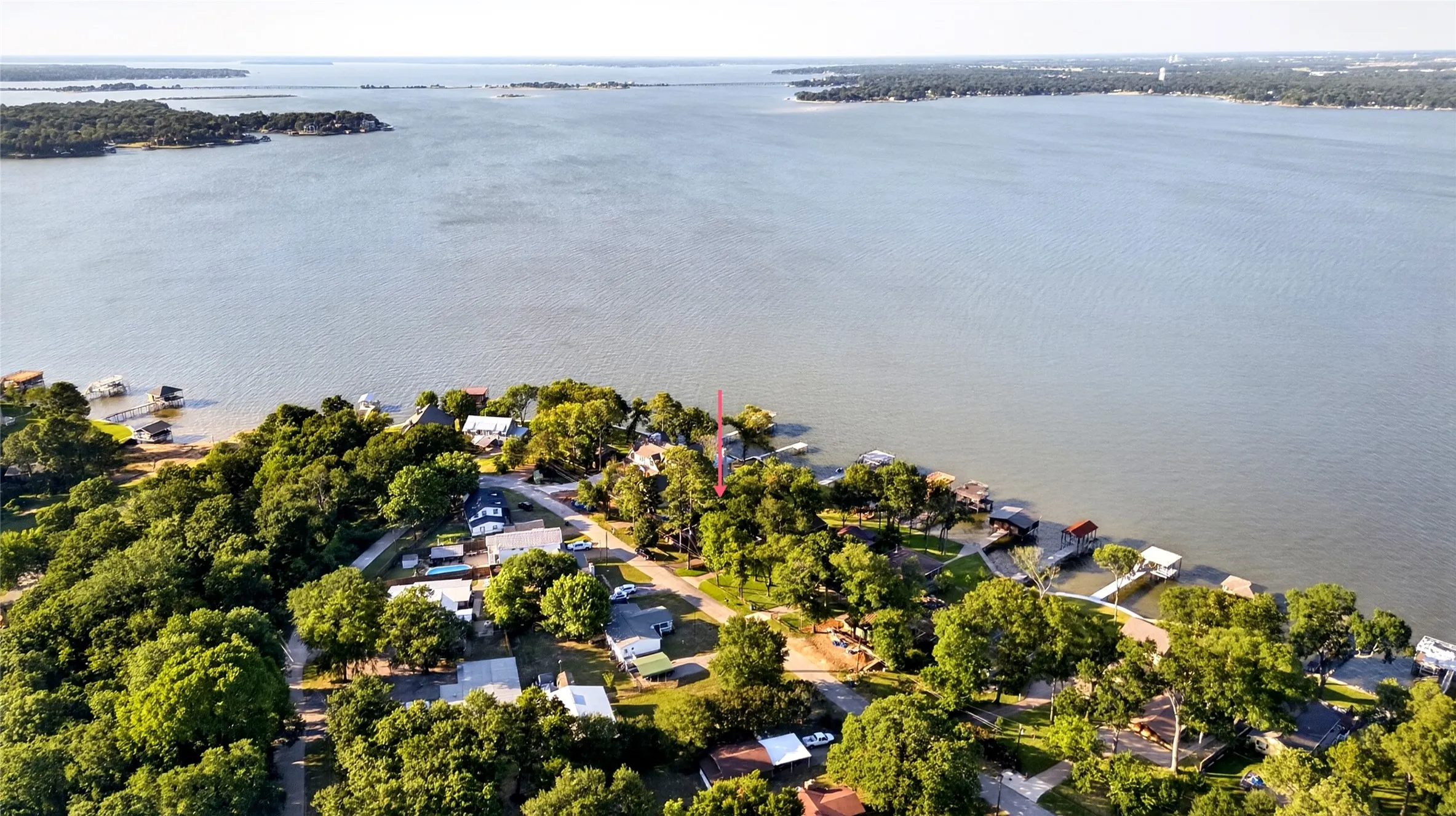 Waterfront property featuring mature trees and a the main body of water. This residence is located in the middle of Cedar Creek Lake. Isn't that water view stunning?