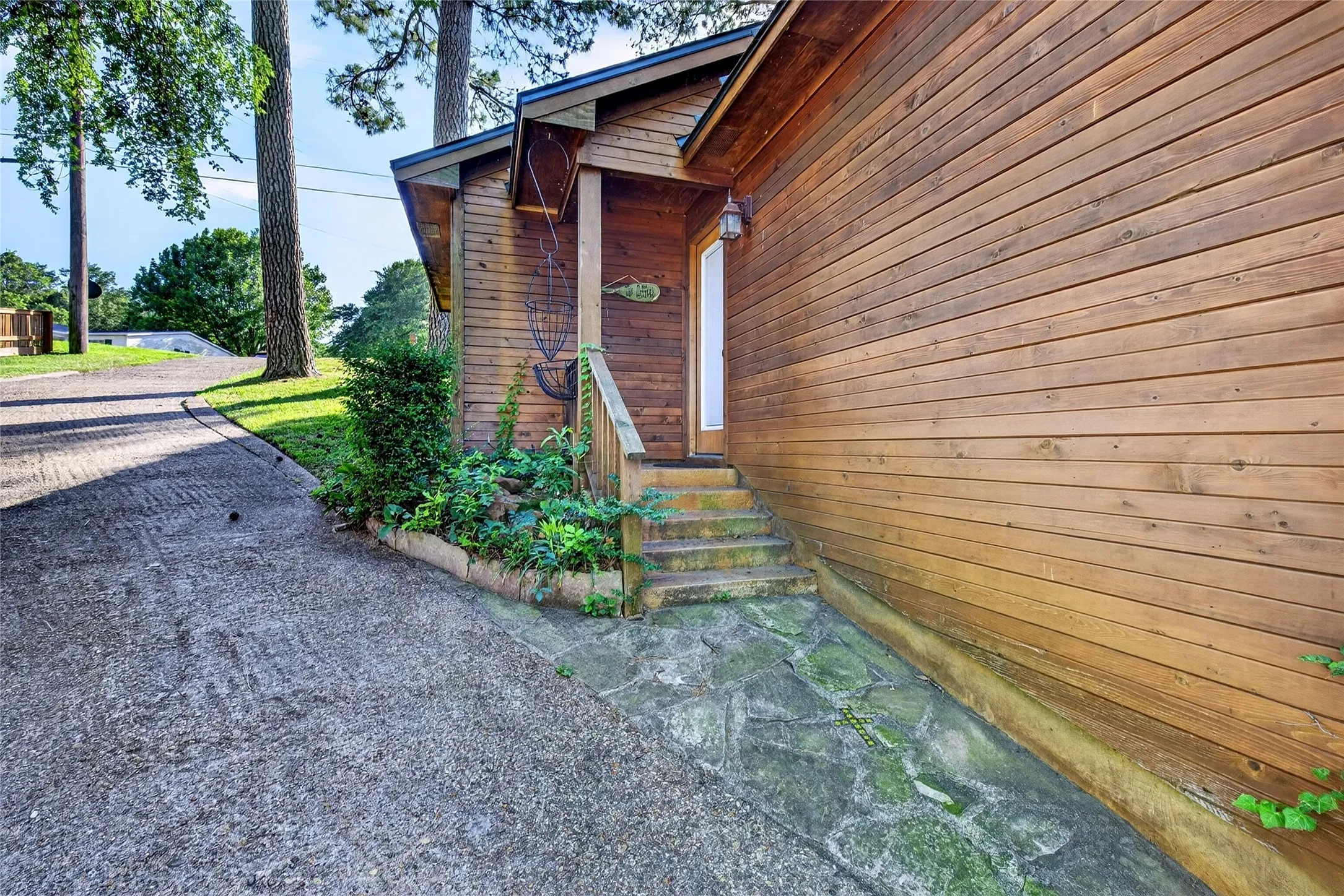 The Cabin was built in 2012 and features a living area, kitchenette, 3 bedrooms, 1 full bath, and 2 half baths with stained concrete floors throughout.