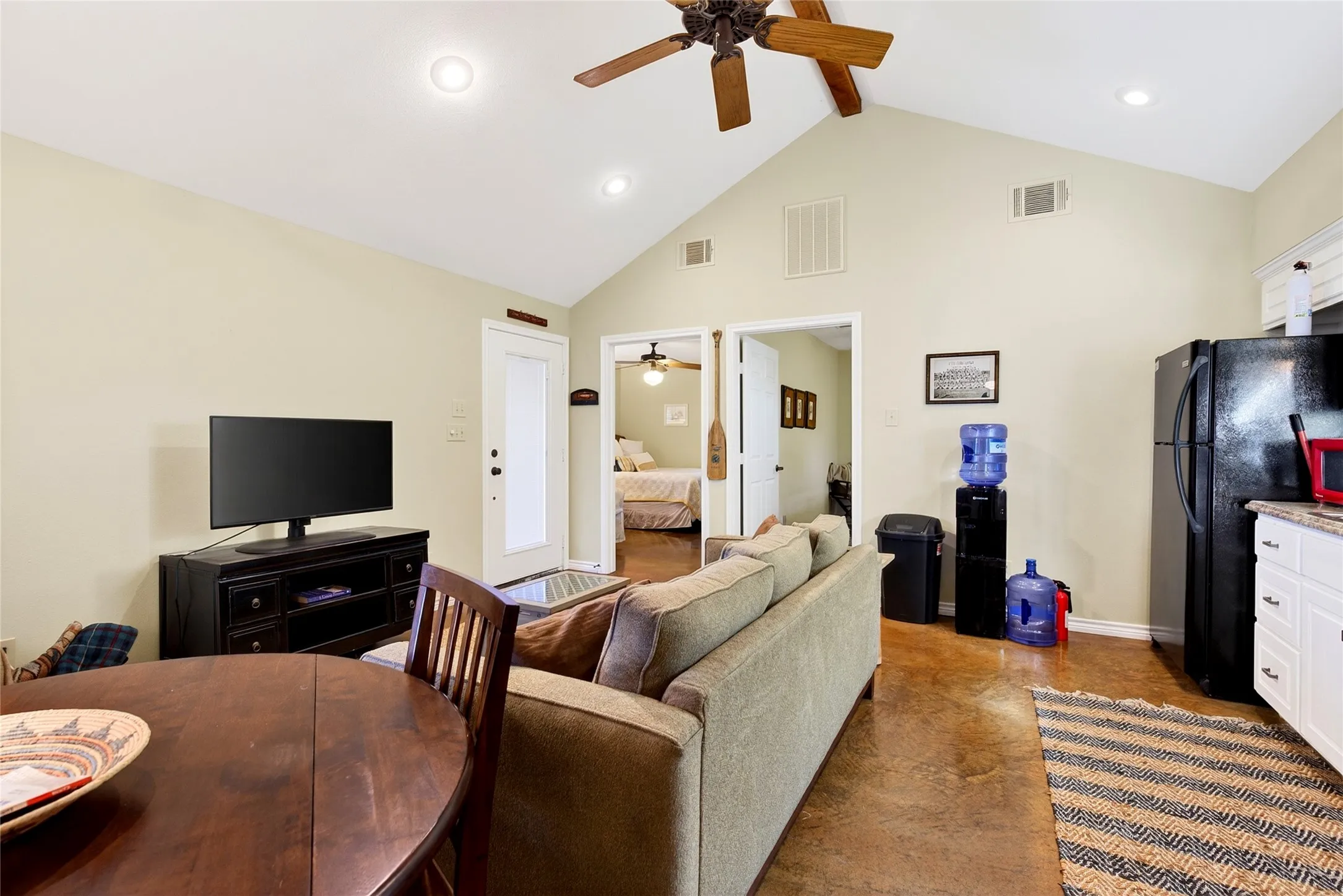 Cabin Living area featuring a vaulted ceiling with recessed lighting, a ceiling fan and kitchenette.