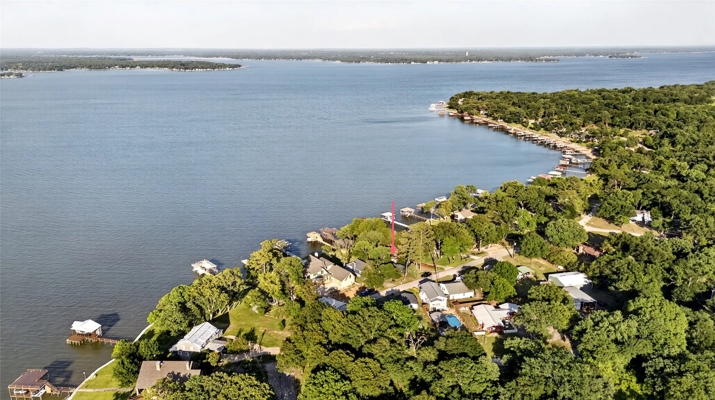 Waterfront property featuring mature trees and a the main body of water. This residence is located in the middle of Cedar Creek Lake. Isn't that water view stunning?