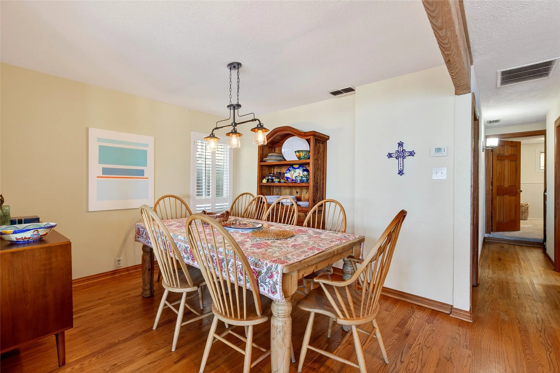 Dining area is open to the kitchen and living.  You can also see that stunning water view from the table.