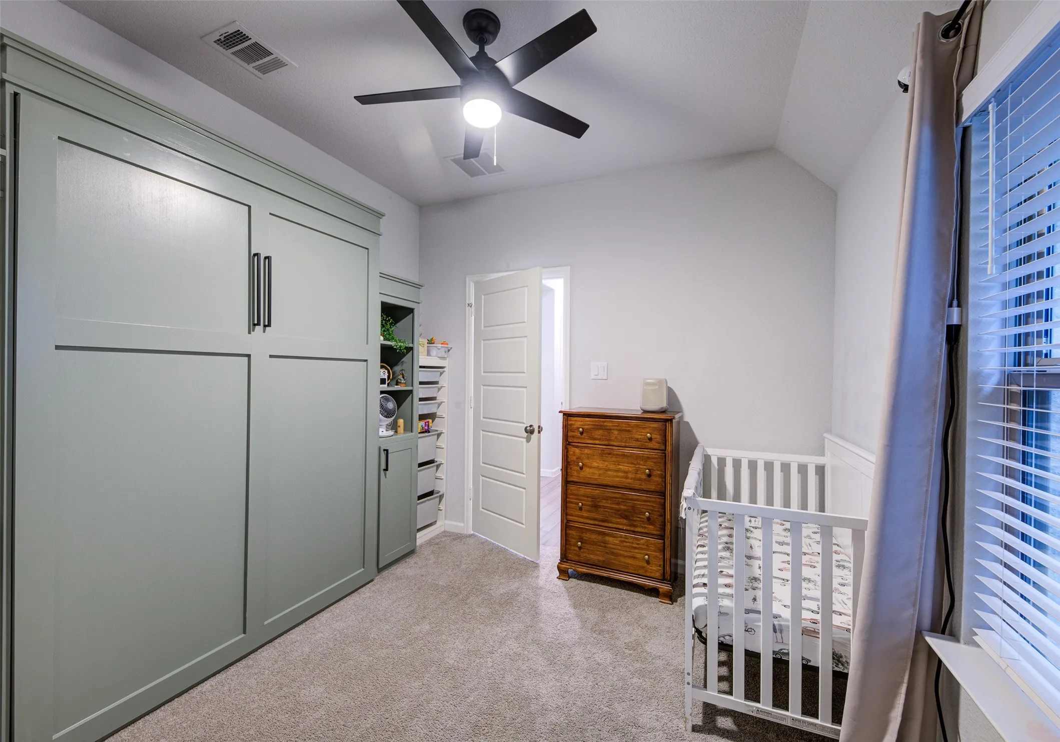 Office or homework nook with soft close cabinetry and built in desk & shelves
