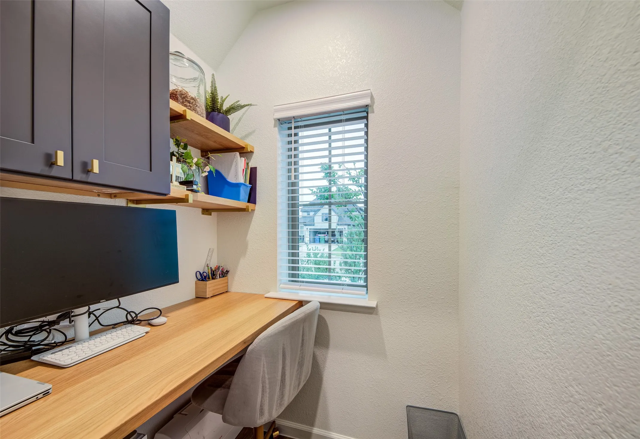 Office or homework nook with soft close cabinetry and built in desk & shelves