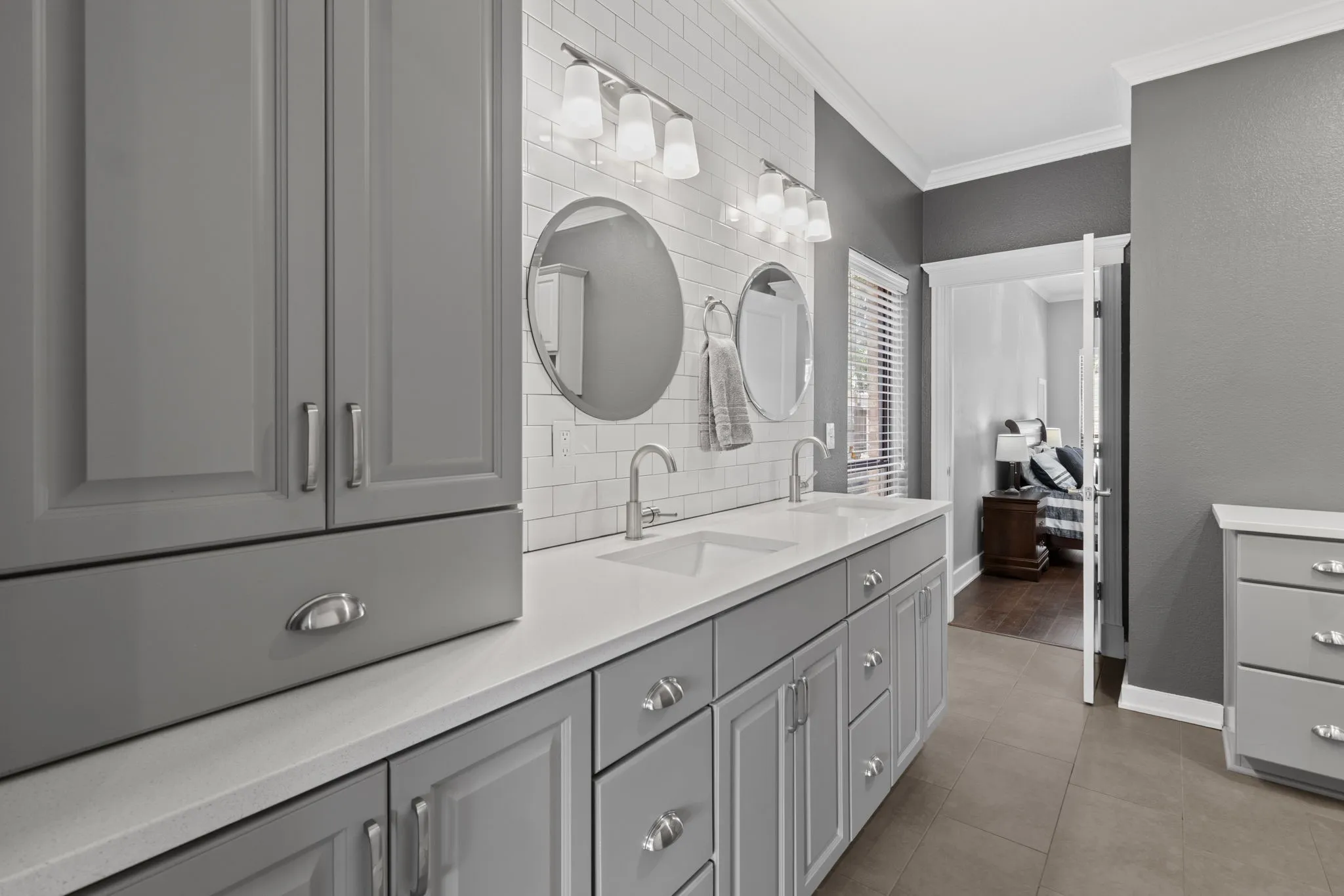Custom cabinets with soft-close, quartz countertop and tile floors.