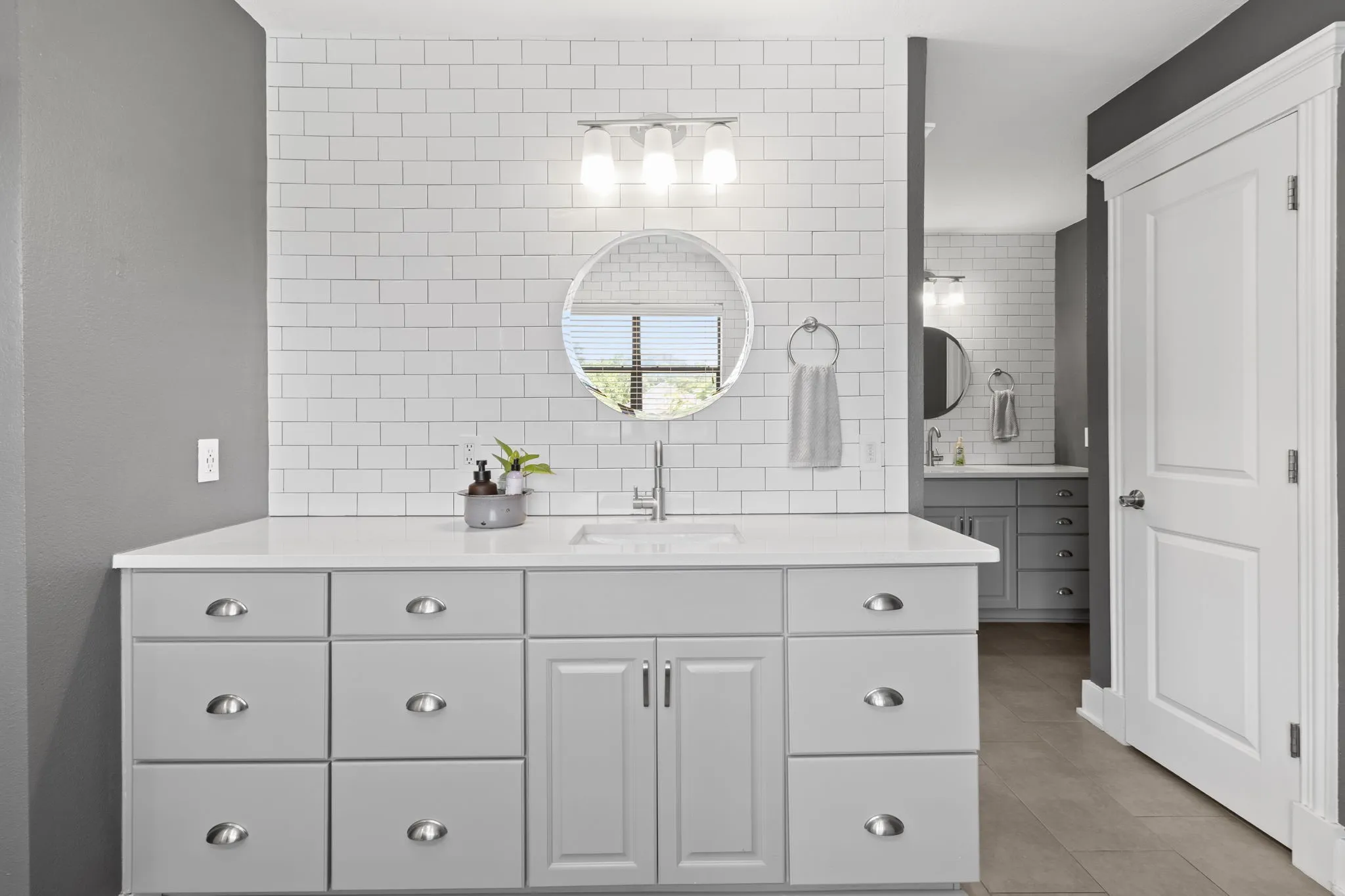 Primary Bathroom with view of 2nd vanity, and 2nd toilet.
