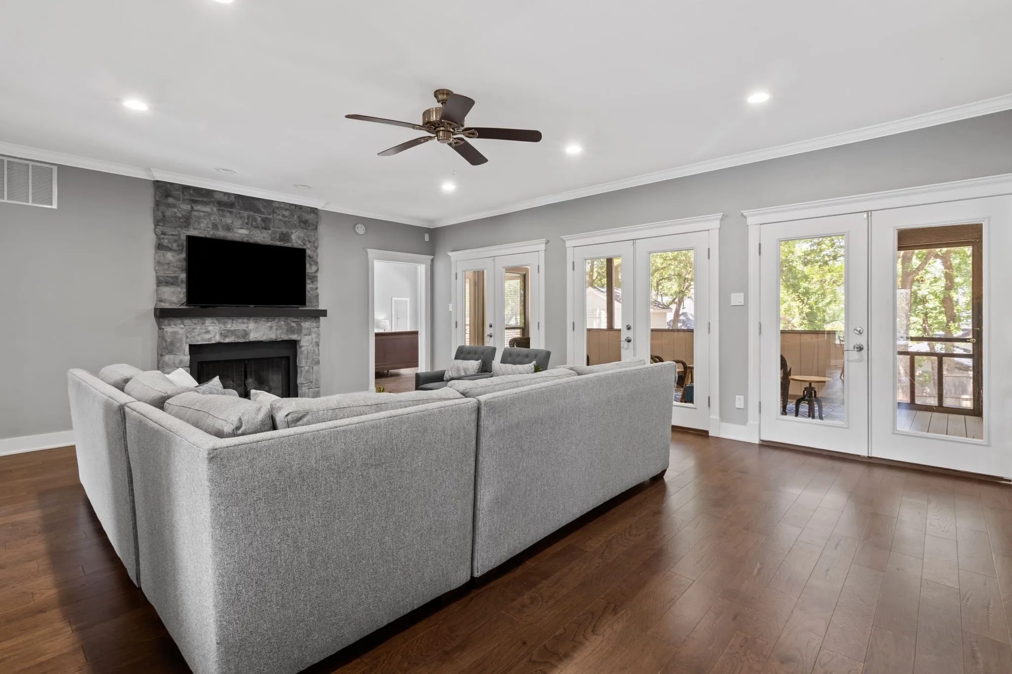The decorative, stone fireplace with gas starter will warm the room on cold nights.