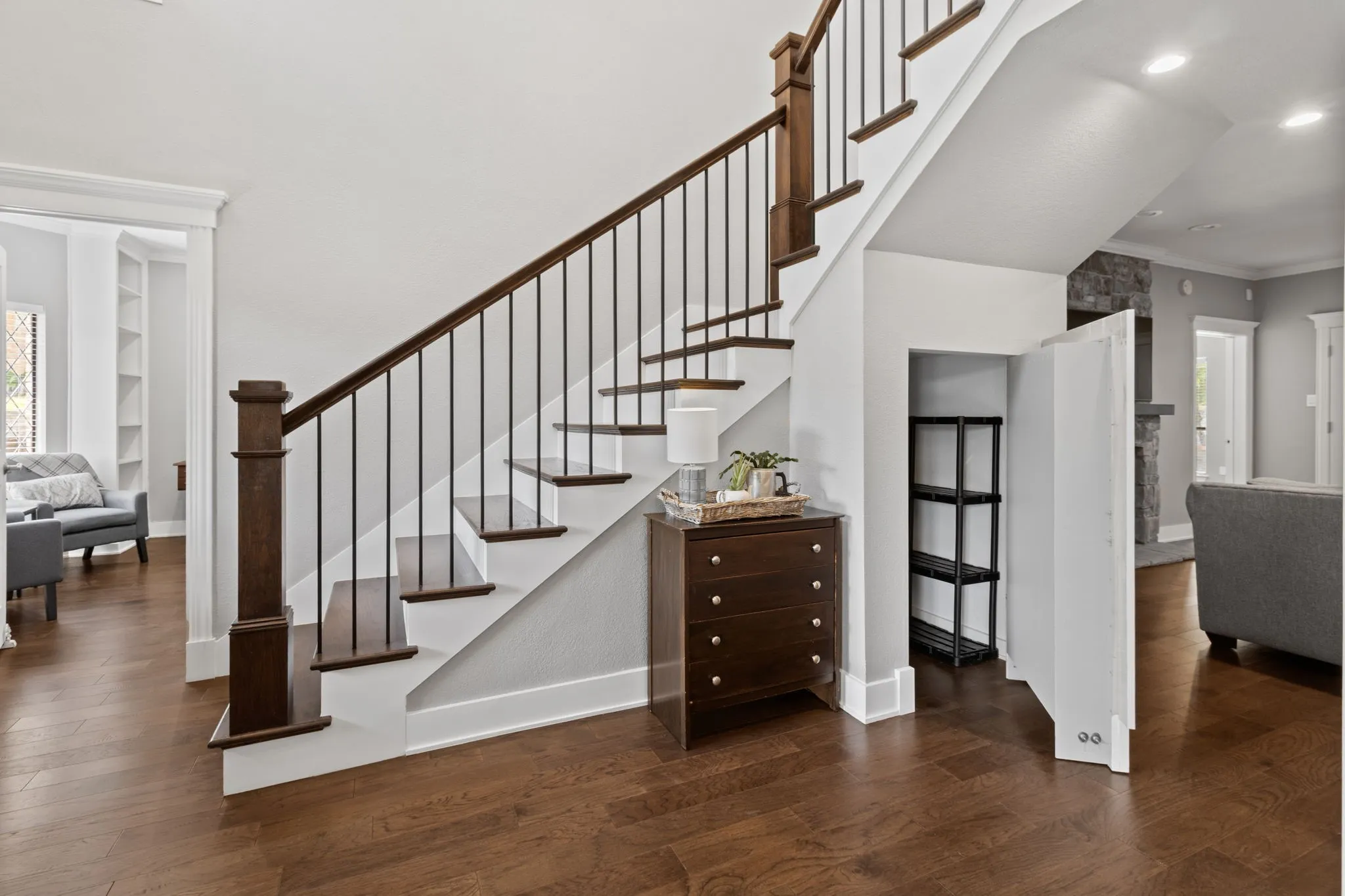 Checl out the entryway with hidden storage behind inset shelving.
