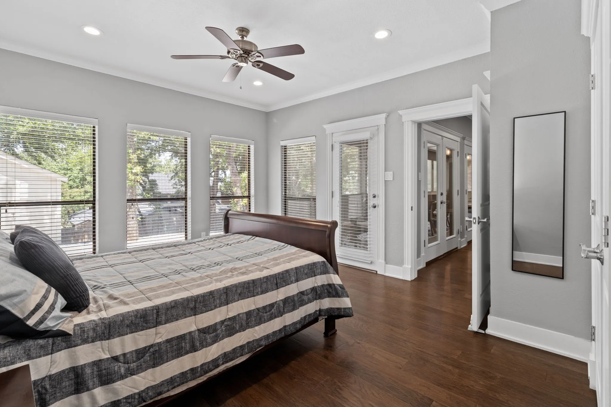 Bedroom number one, (found in the rear of the home 1st floor) with access to the back patio. Ceiling fan, and spacious closet.