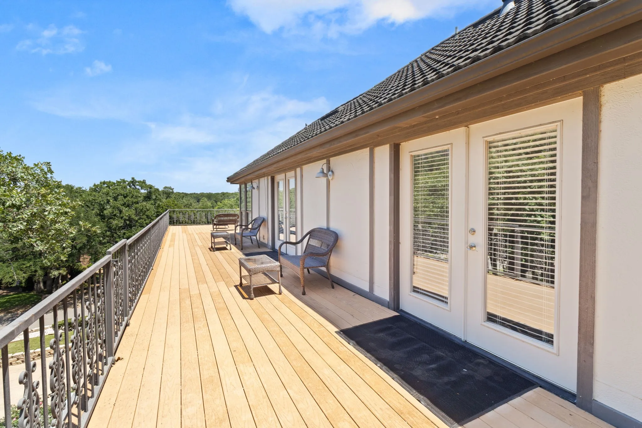 Outdoor Deck with entrances from both the Primary Suite and 3rd Bedroom.